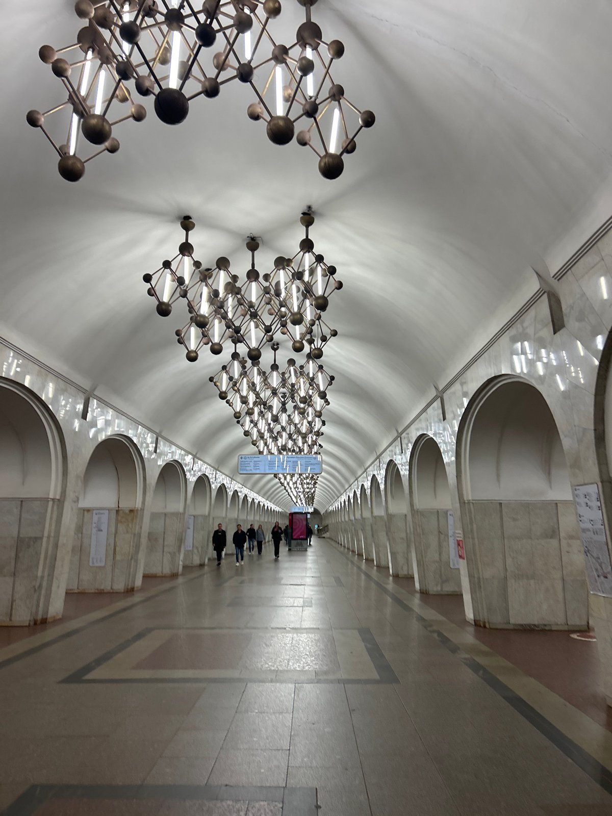 Evening urban documentation includes subway station and illuminated buildings