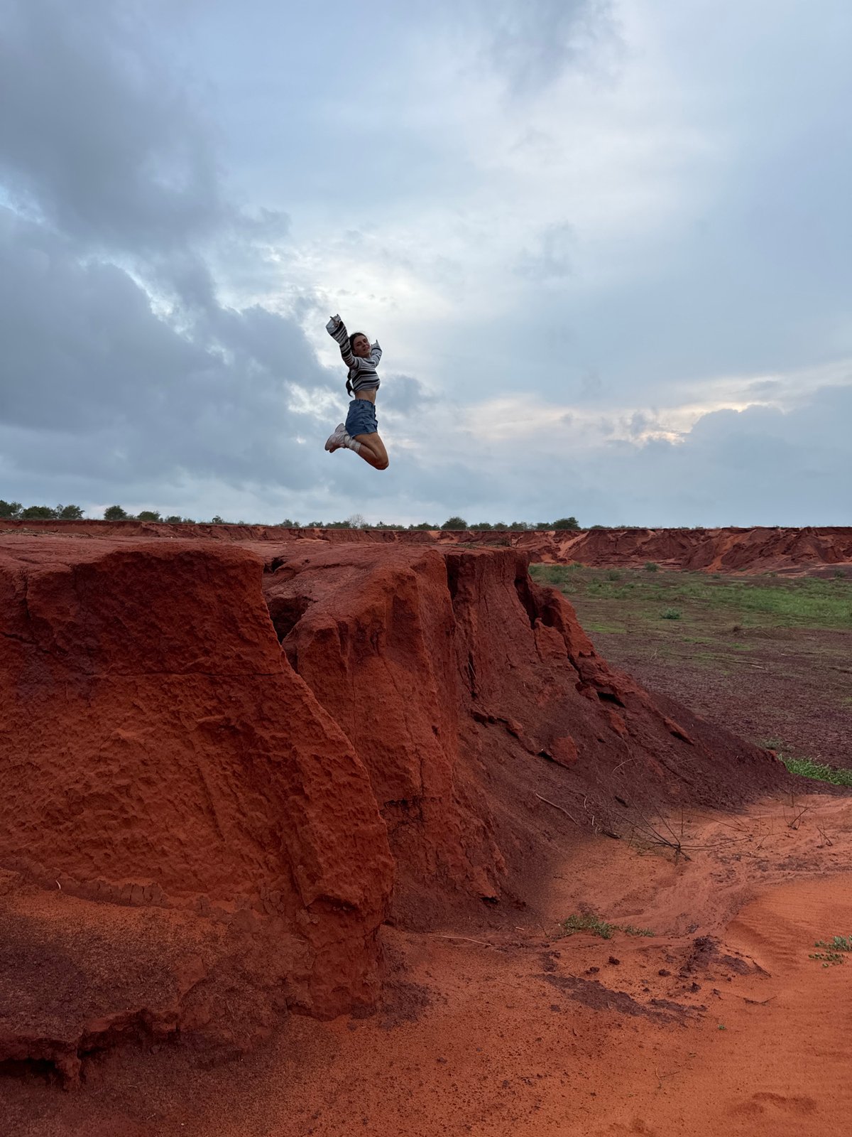 Tourists pose at Mui Ne's red sand canyons