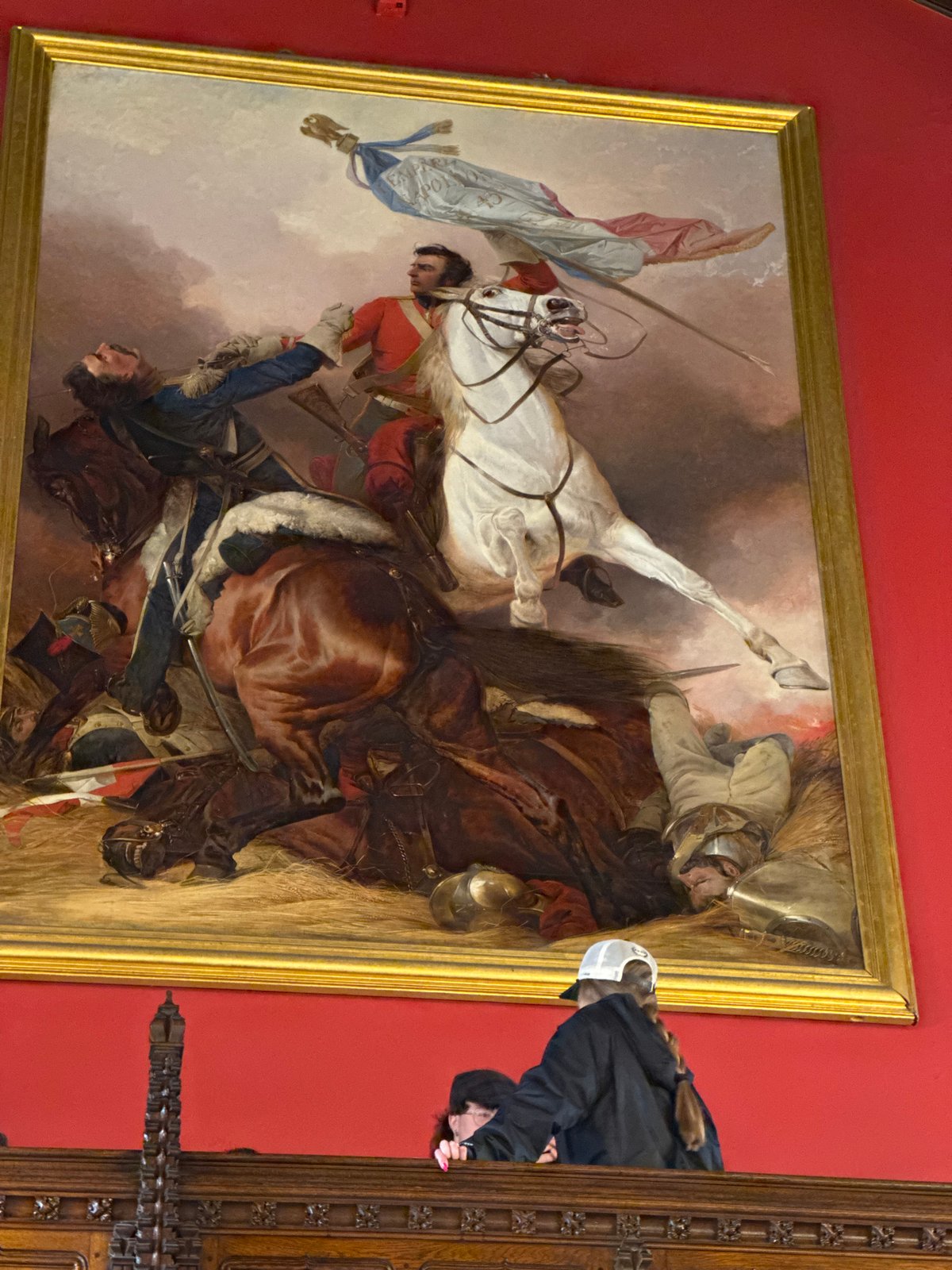Tourist documents historical artifacts during Edinburgh Castle visit