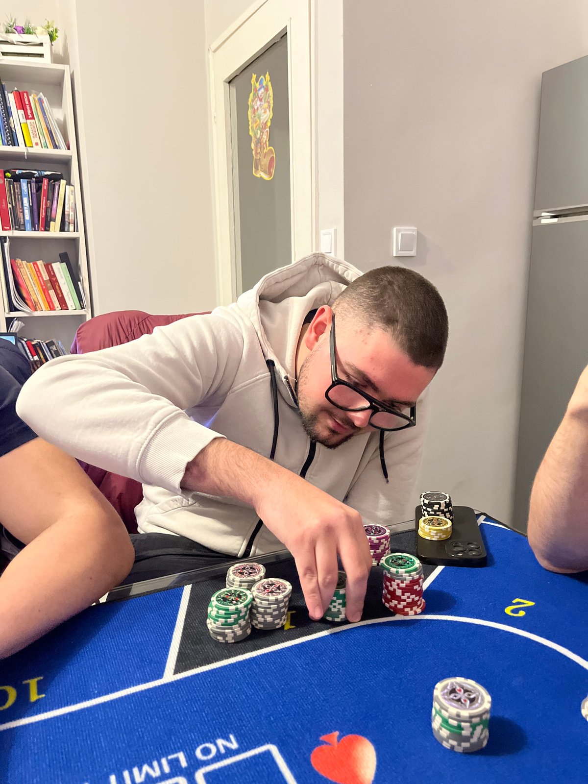Man plays poker, stacks chips at Burgas table