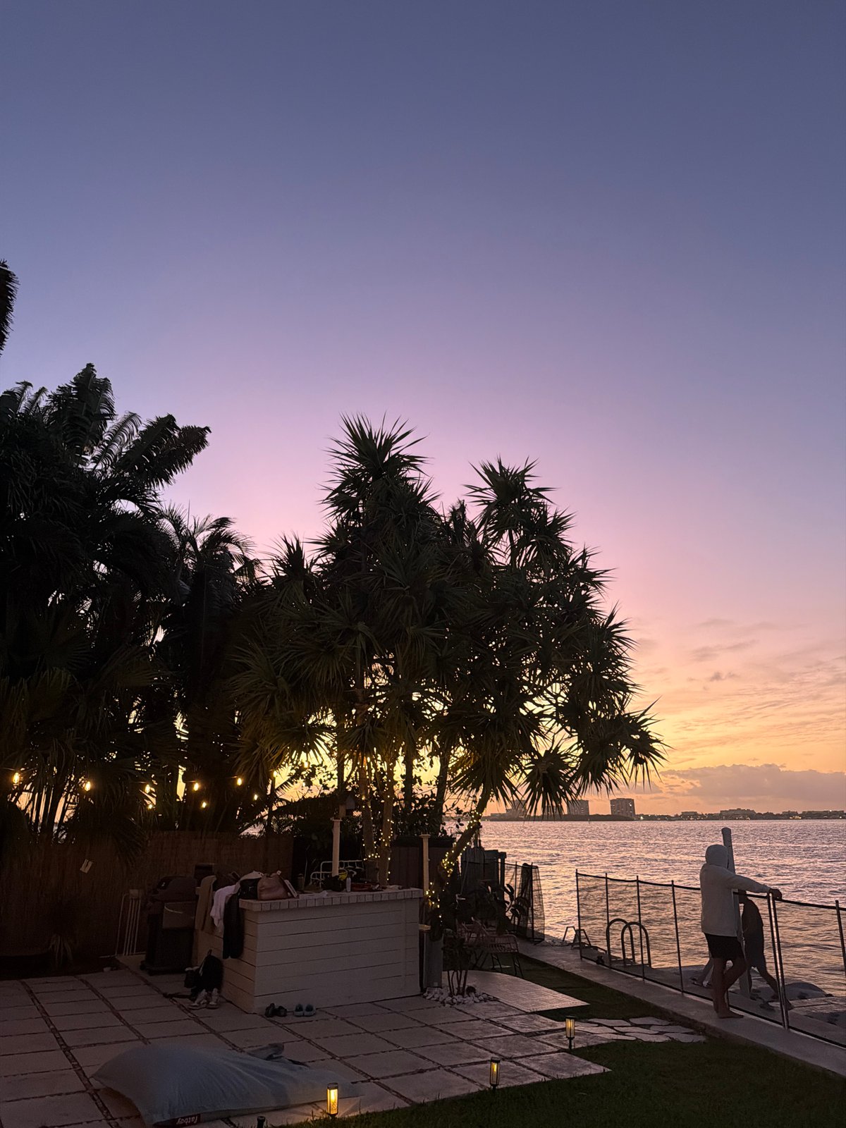 Miami Beach waterfront displays colorful sunset gradient at dusk
