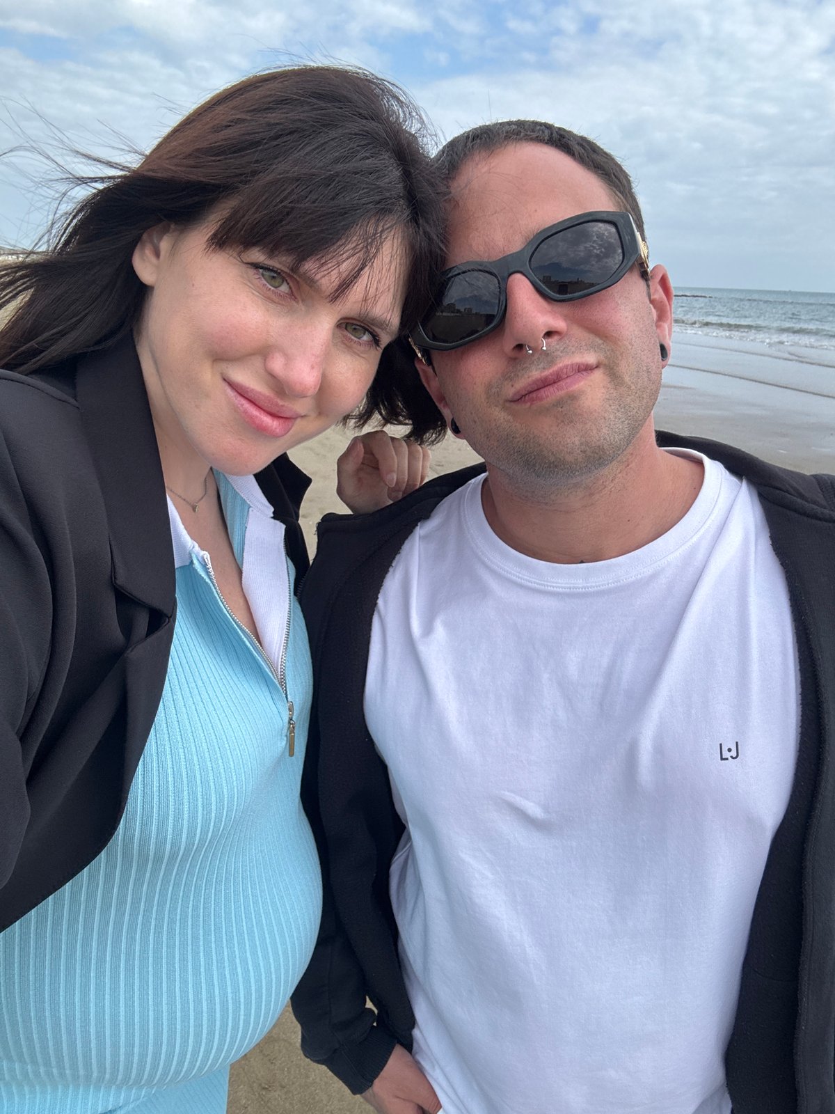 Couple and dog spend afternoon at Nettuno beach