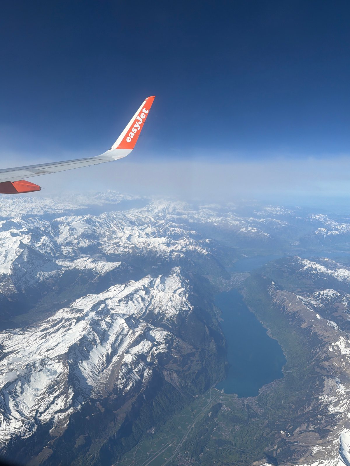 Passenger documents Alpine mountain views from easyJet flight over Milan