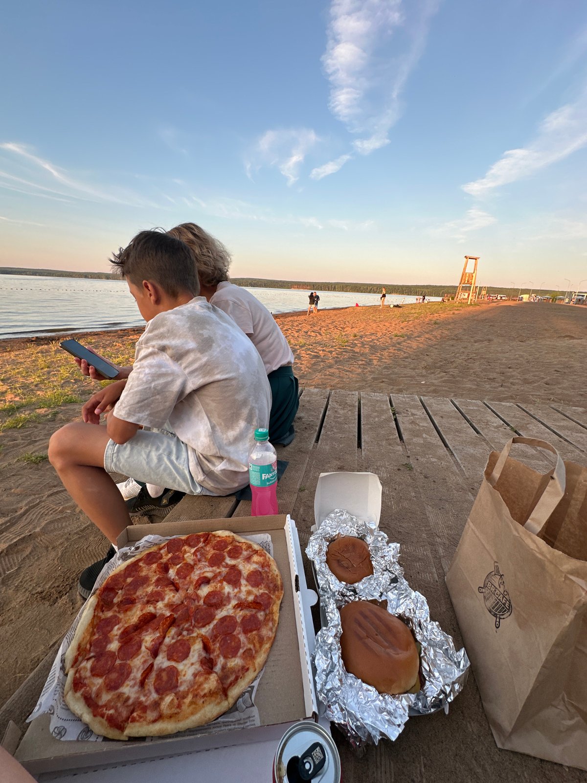 Pizza and chill by the lake at golden hour