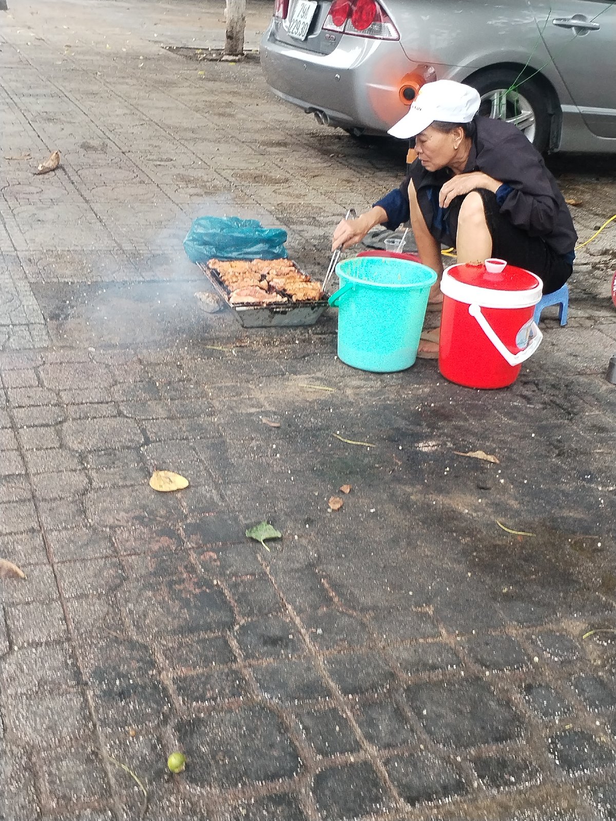 Street food vendor operates stall in Nha Trang