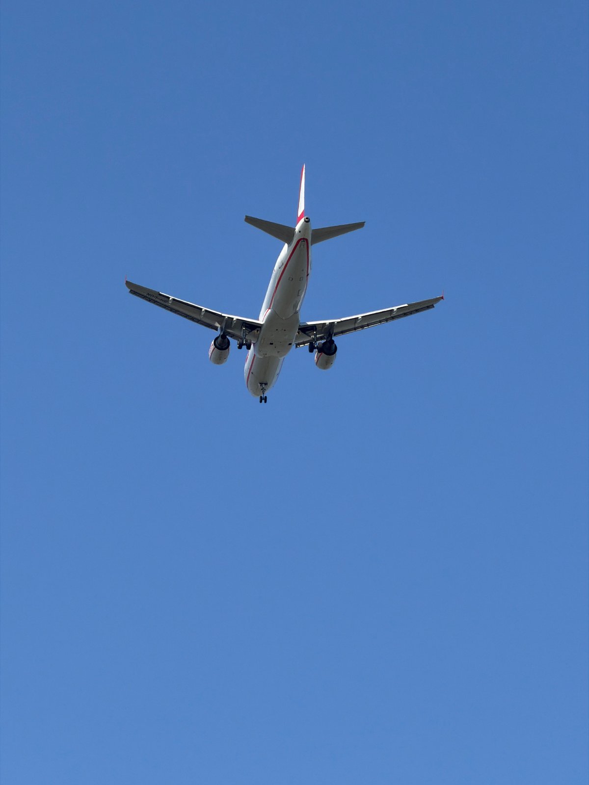 Passenger jet on approach over Burgas, landing gear down