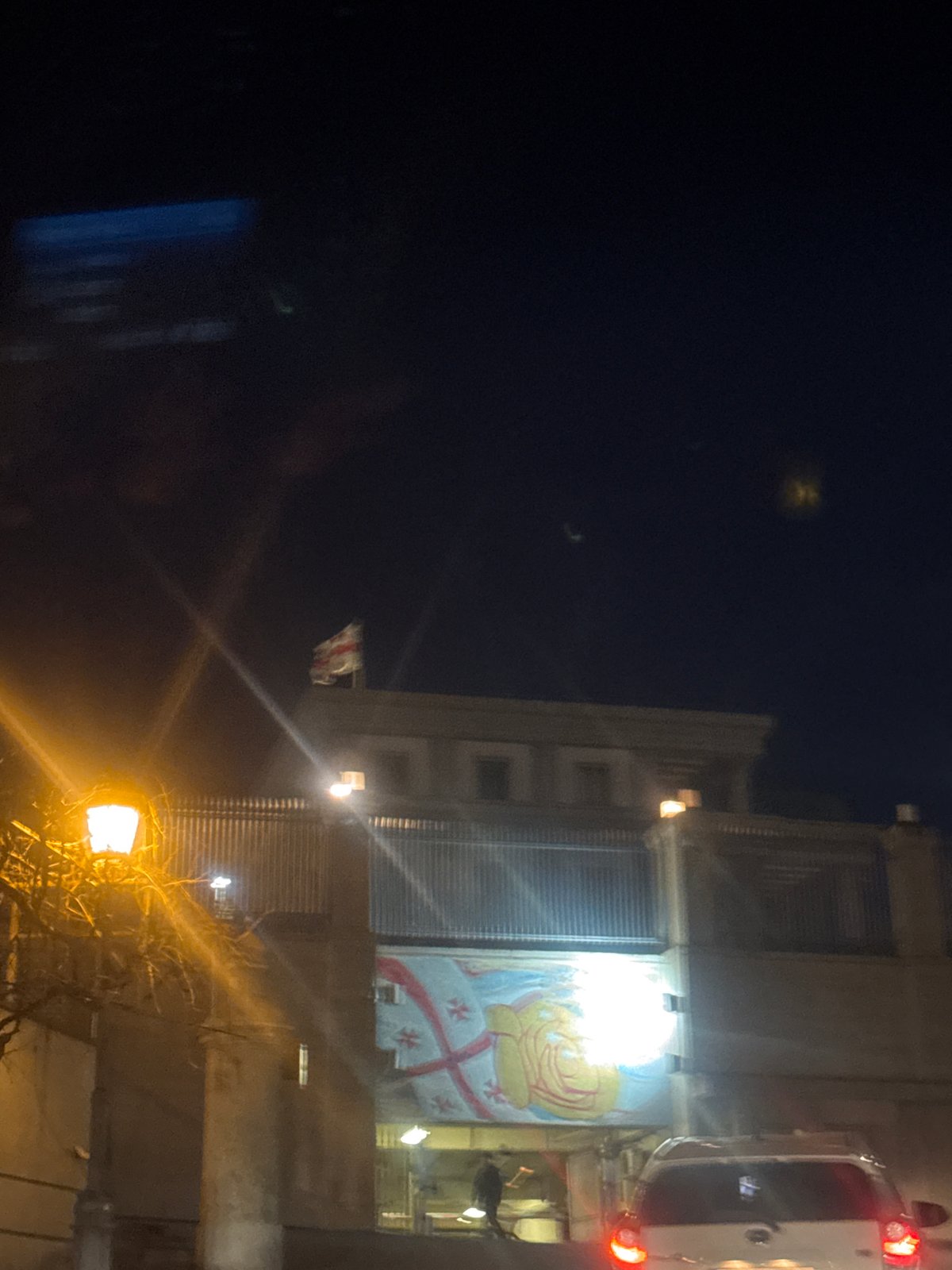 Illuminated religious and decorative displays spotted on Tbilisi buildings