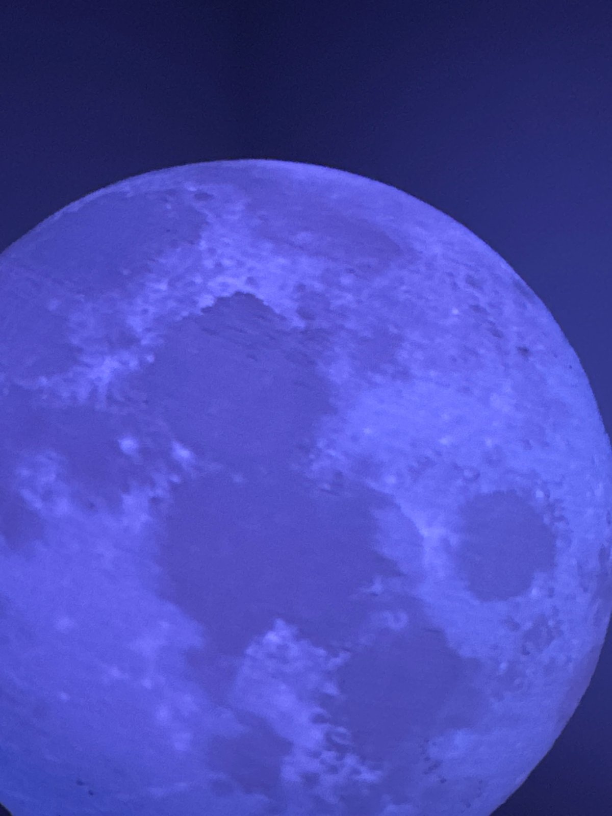Late-night moon photography session over Lübeck rooftops
