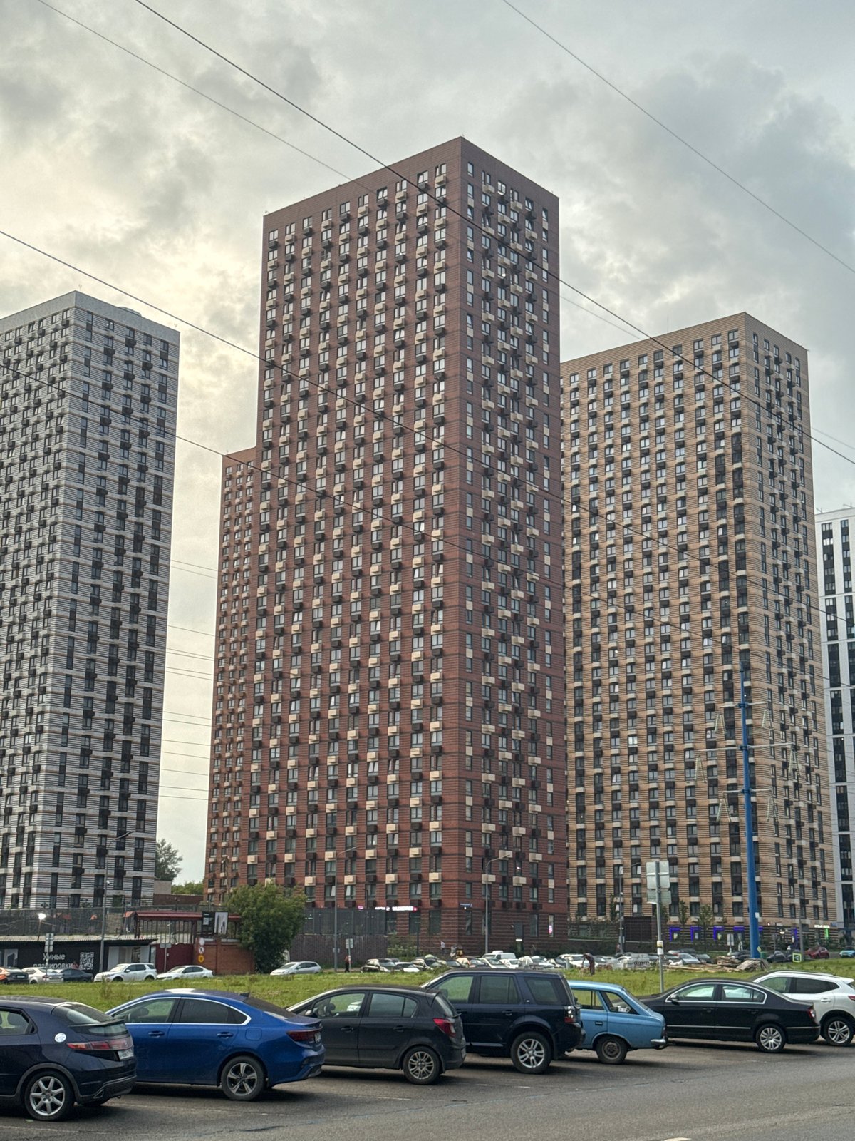 Modern apartment blocks line a Dolgoprudny residential street