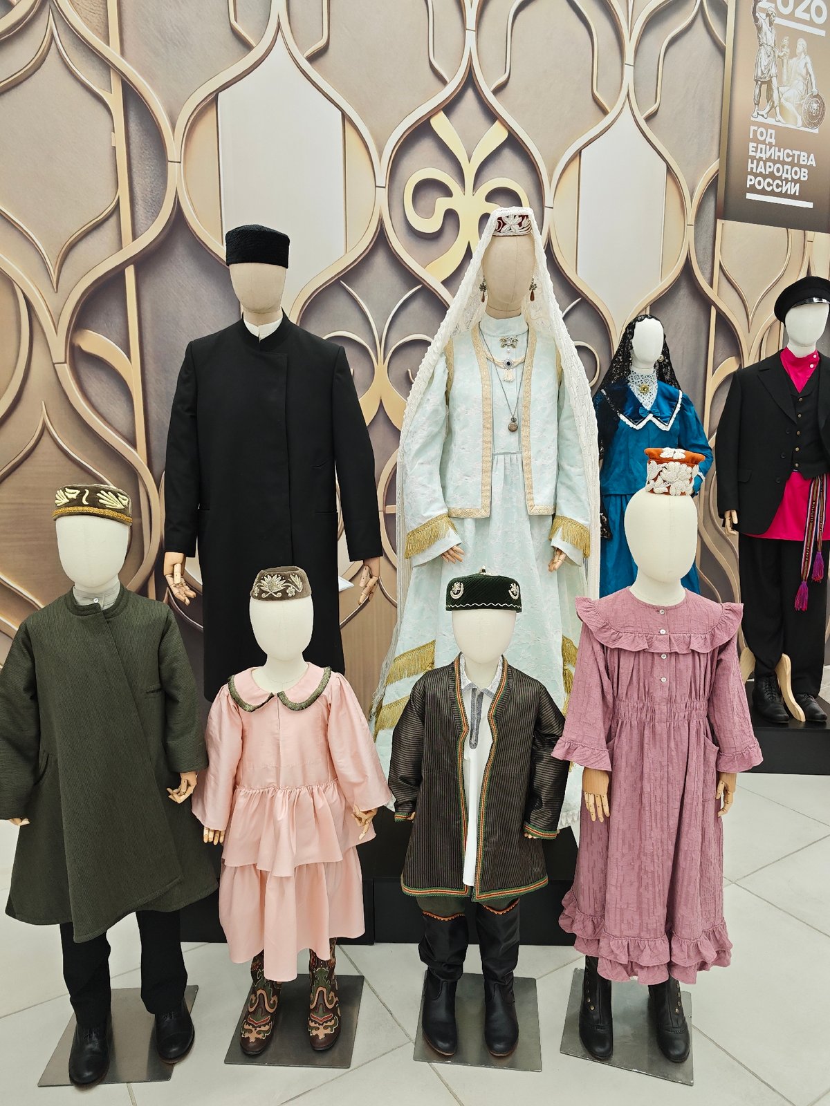 Folk costumes, samovars, and crowds at a cultural exhibition