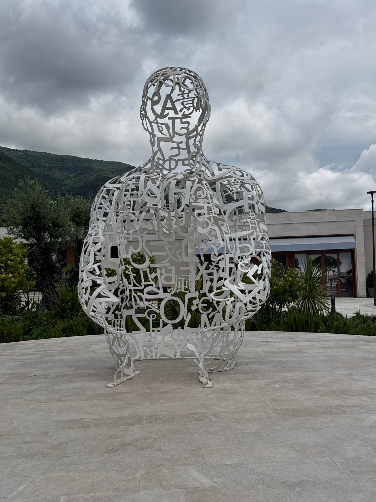 Woman photographs herself around Tivat, Montenegro attractions