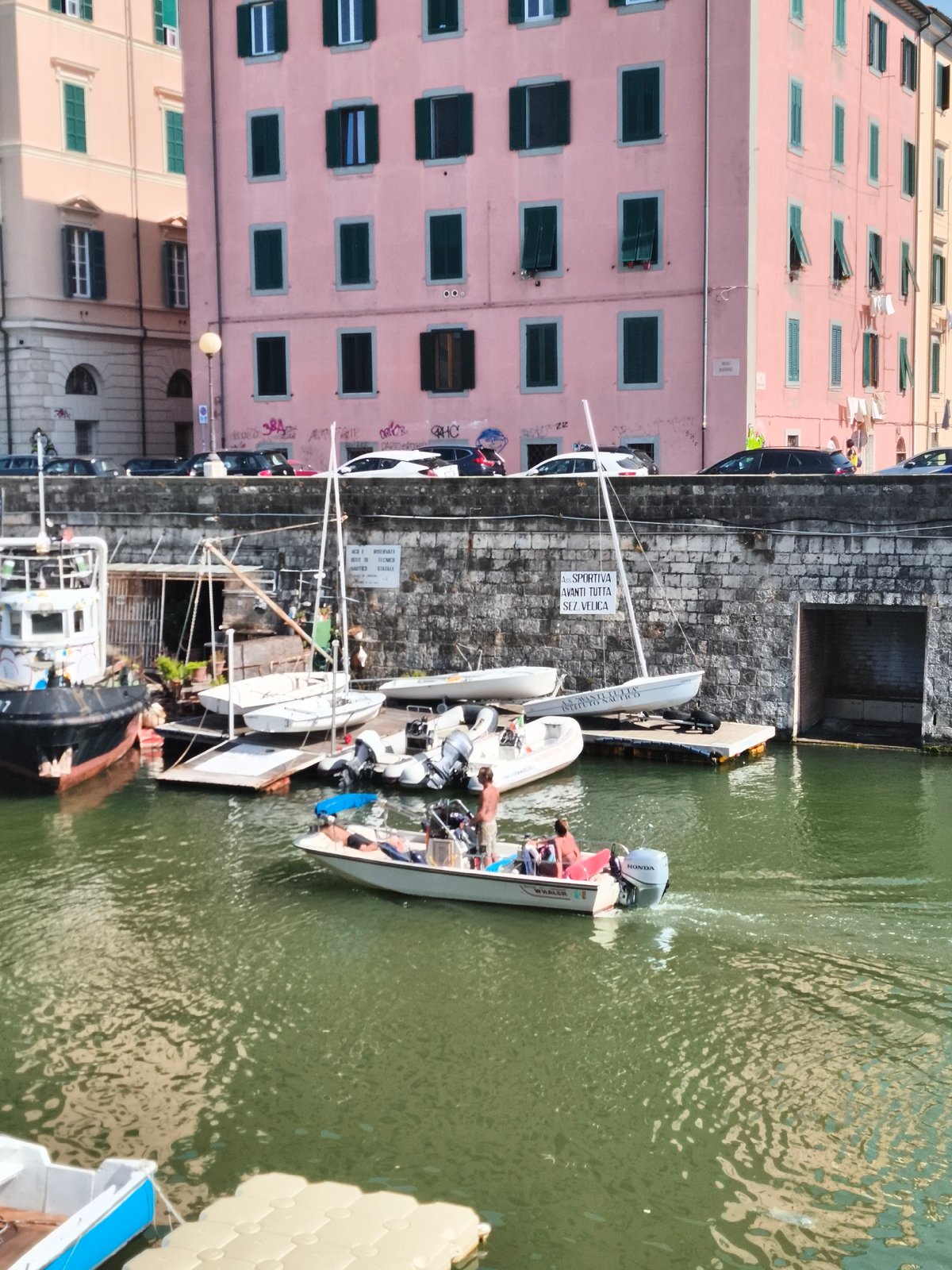 Sunny afternoon exploring Livorno's waterfront and canals
