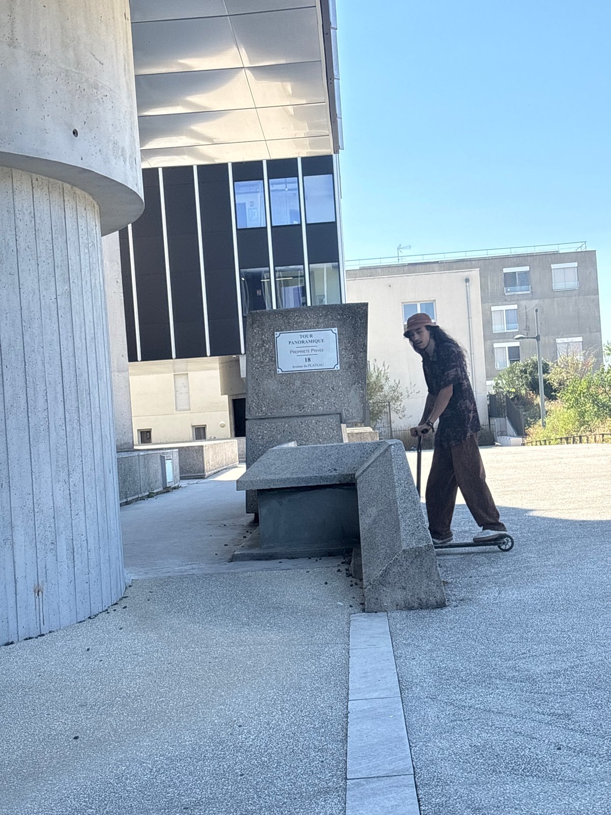 Parkour and scooter tricks among Lyon's brutalist concrete blocks