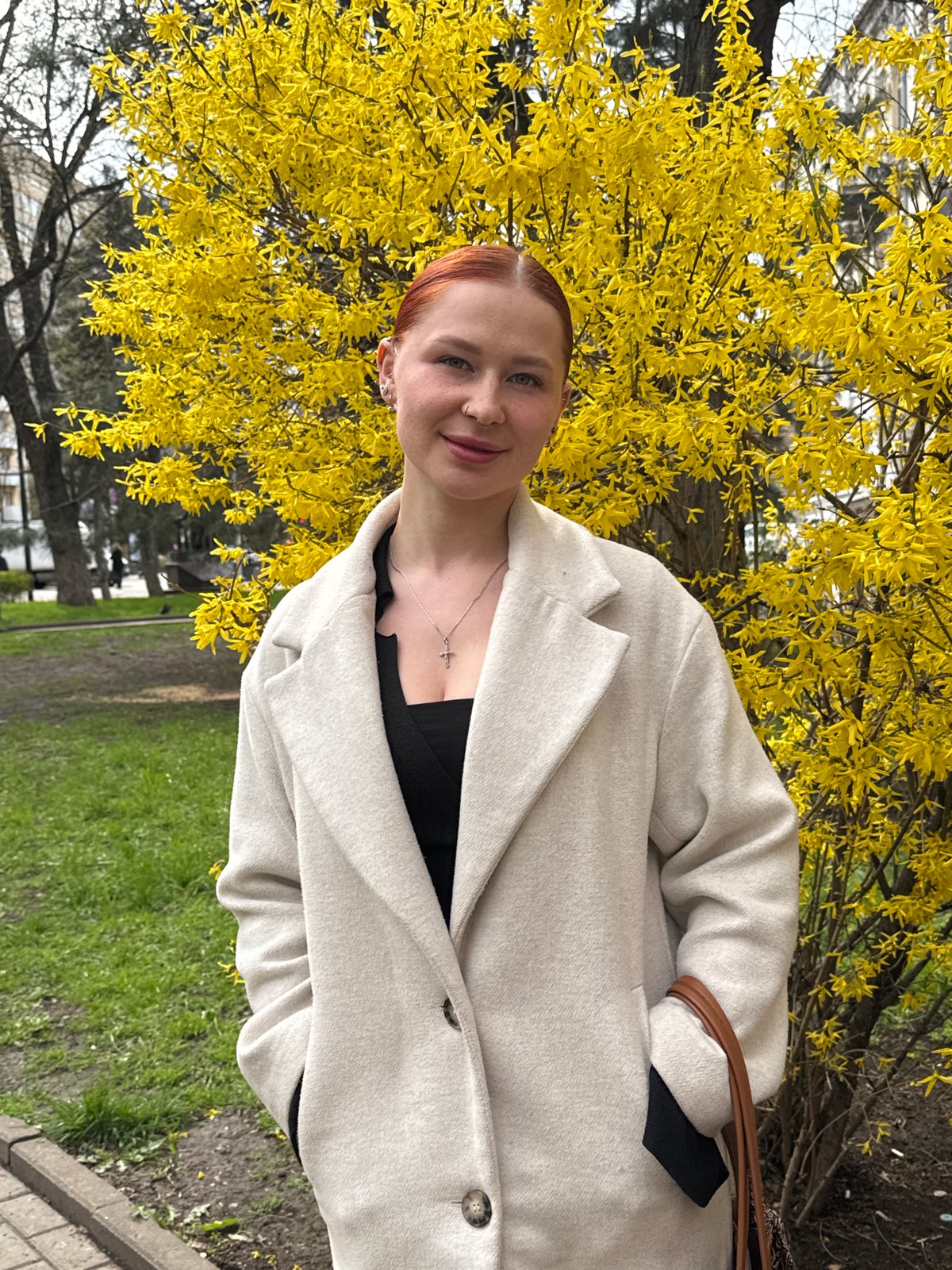 Spring portraits captured near blooming forsythia in Ovoshchnoy, Russia