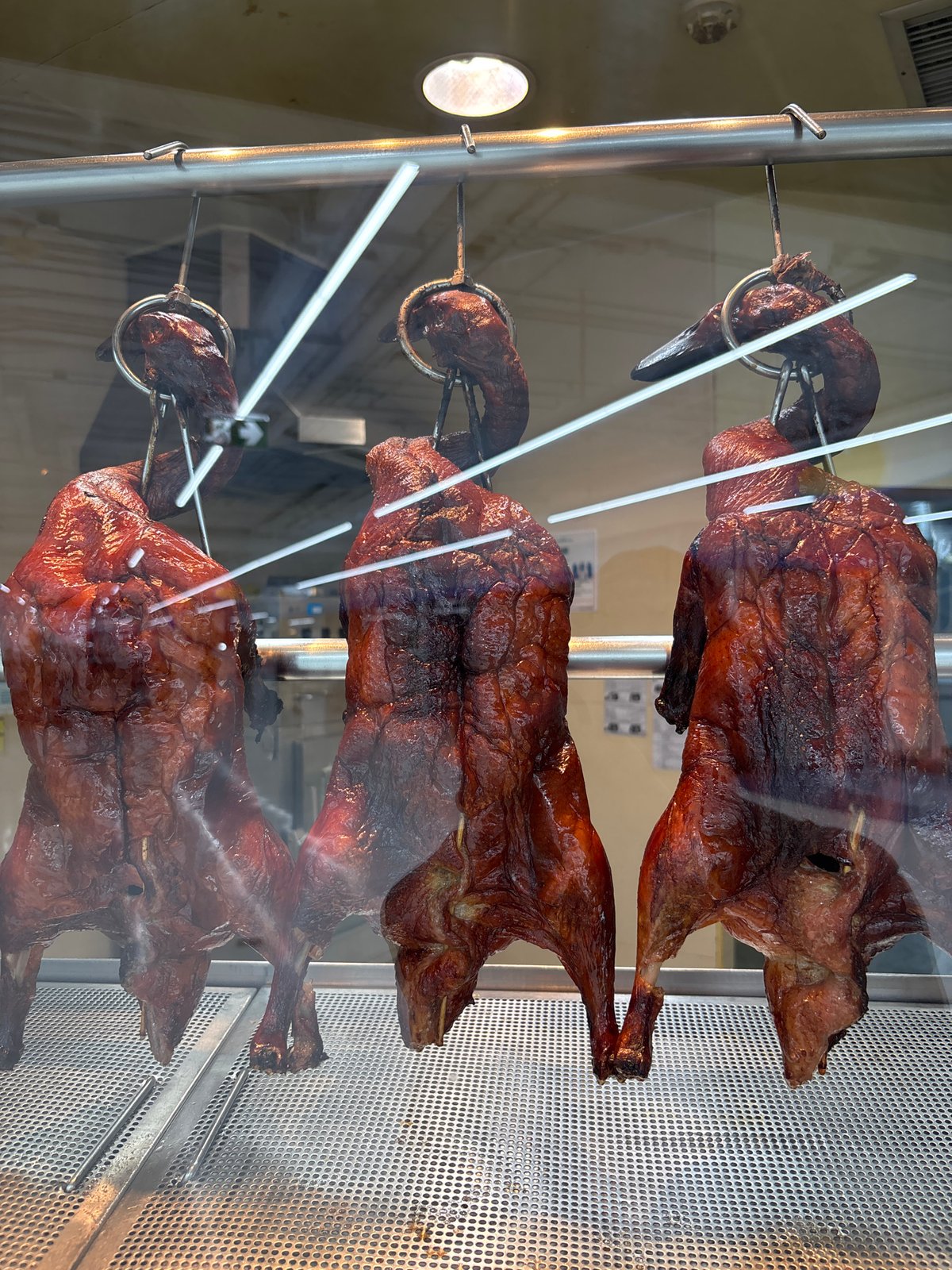 Roasted ducks displayed in glass case, Baan Bo Phut