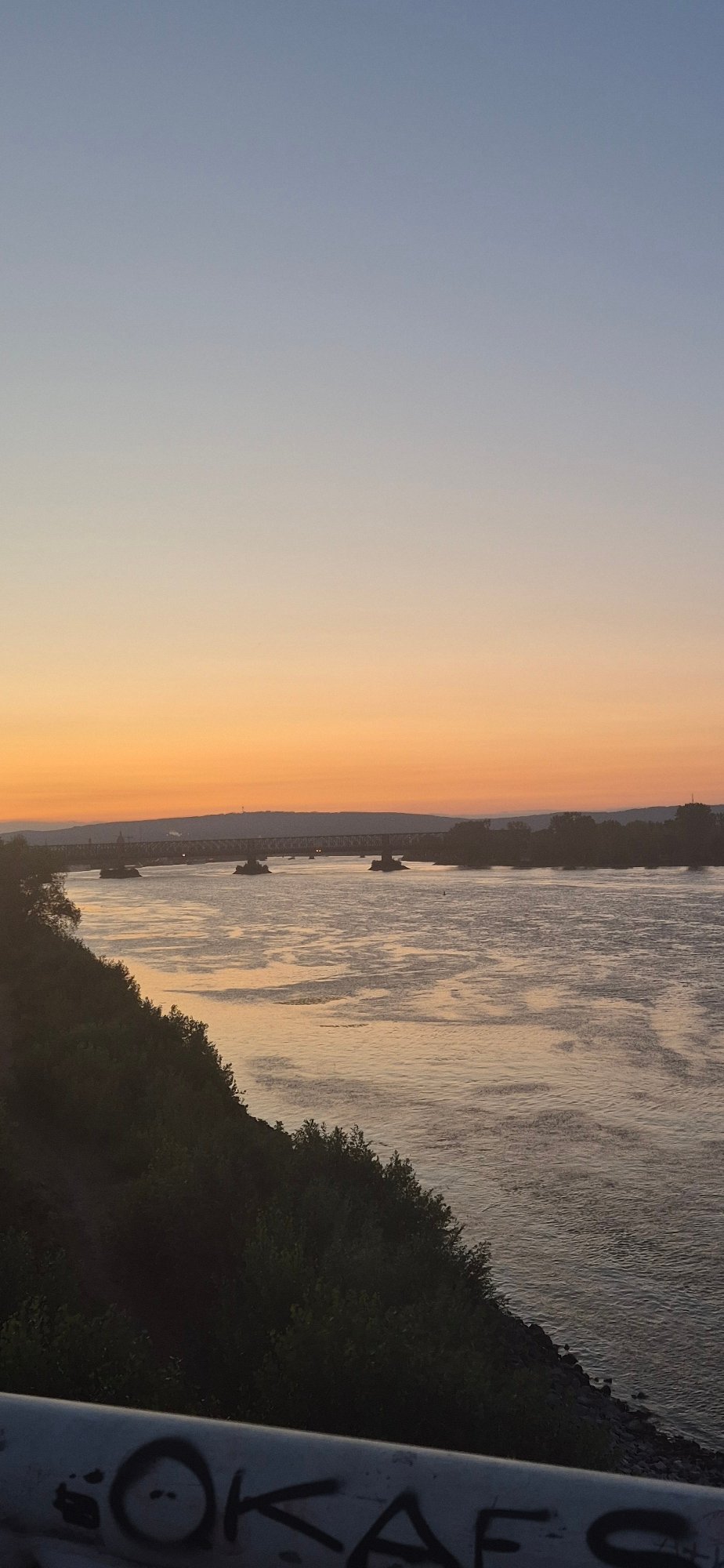 Rhine sunset in Mainz, with aircraft and mystery light overhead