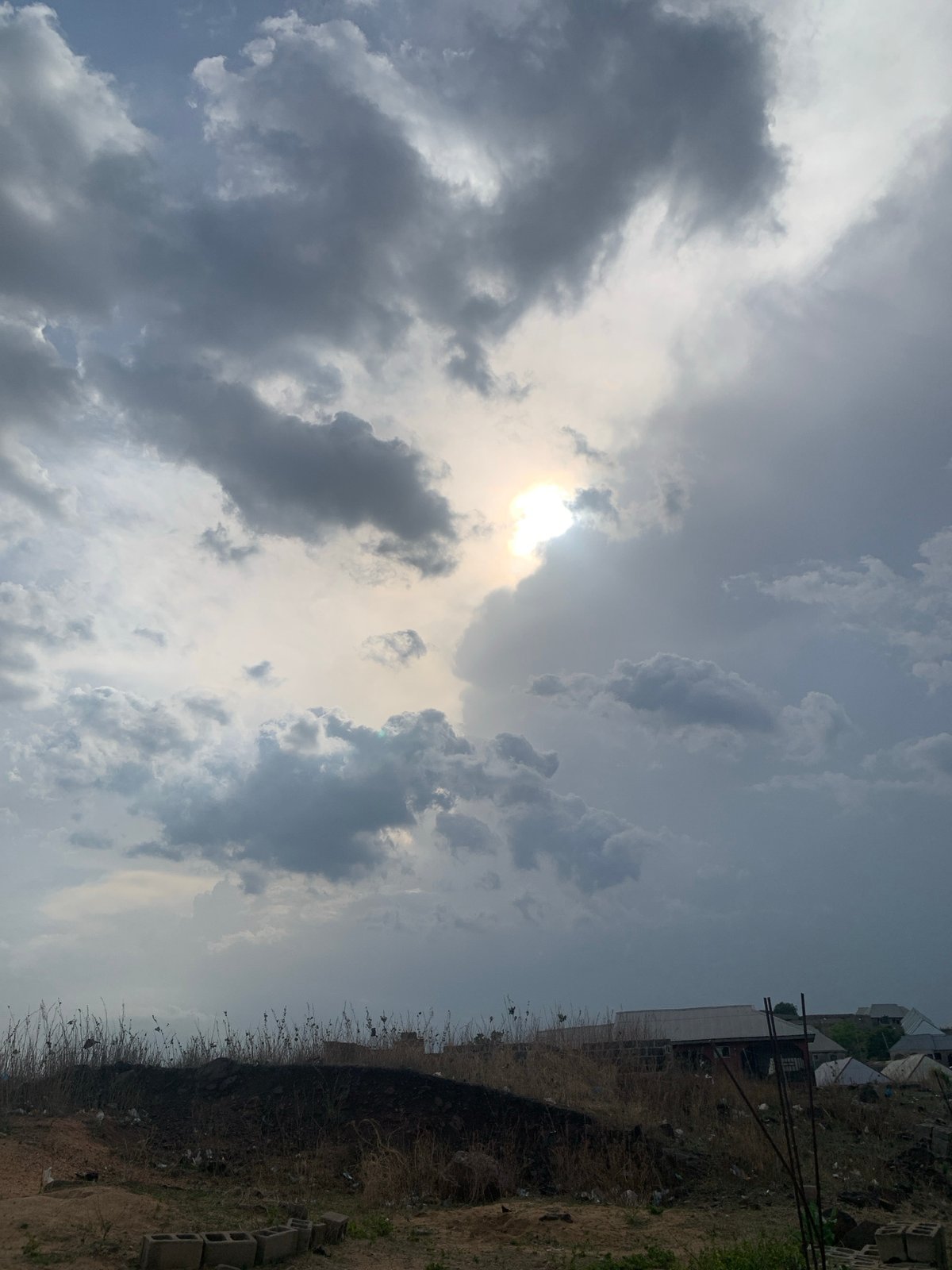 Cloudy skies and settlement views documented in Lokoja, Nigeria