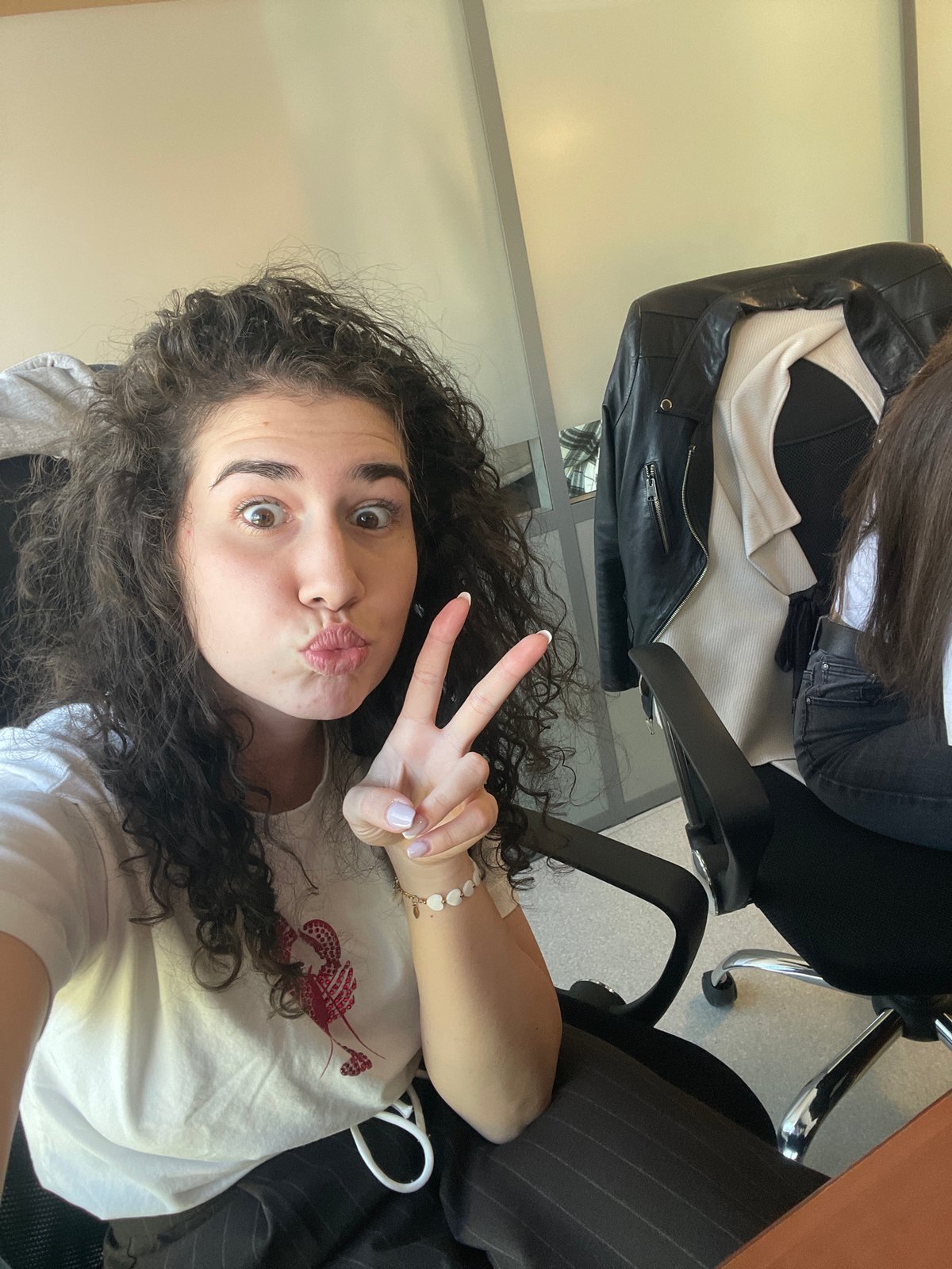 Woman documents office workday through selfies in Sofia