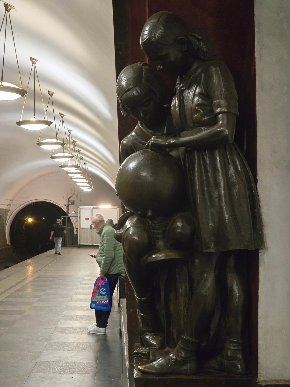Bronze sculptures documented at Stockholm Metro Station during morning commute
