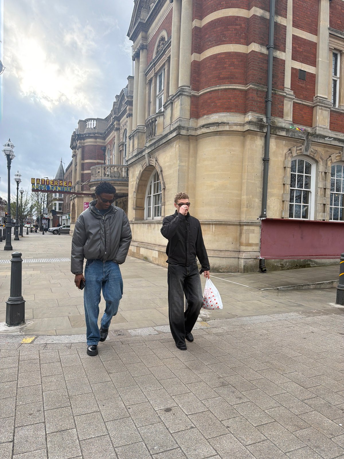 Diners photograph outside London restaurant with rotisserie chicken display
