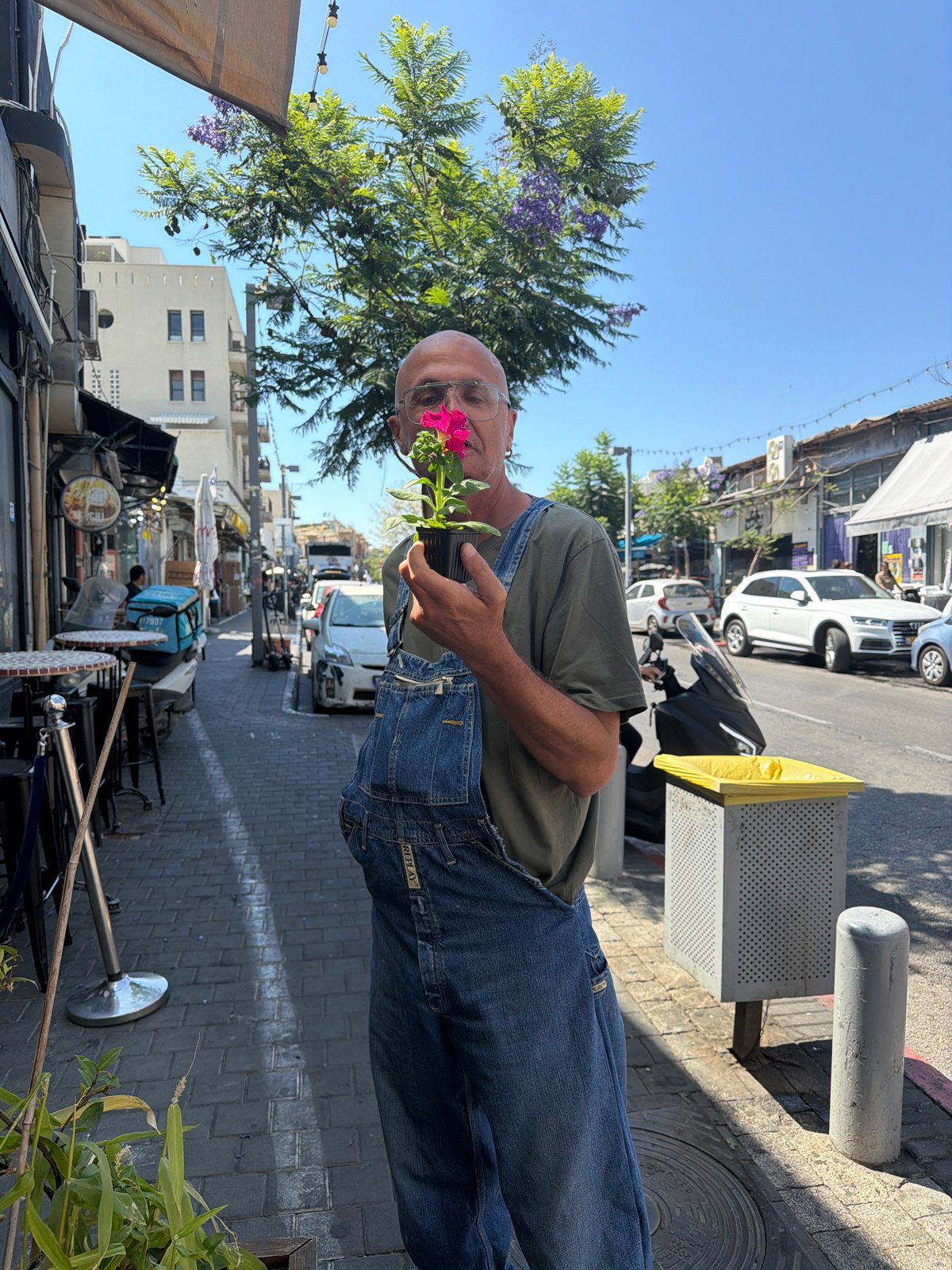 Street scenes captured in Tel Aviv featuring flower vendor