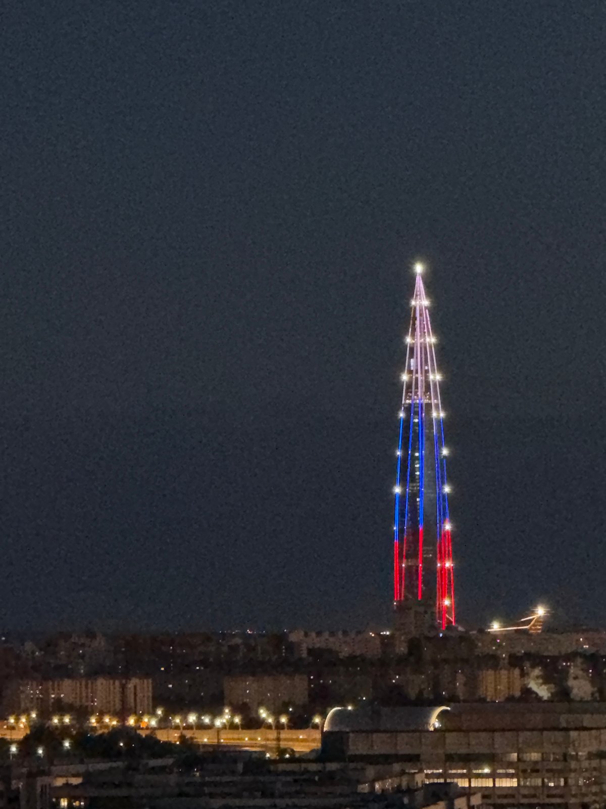 Lakhta Center displays Russian flag colors in evening illumination
