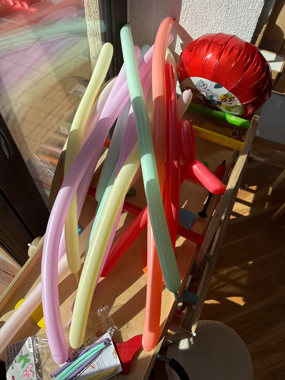 Person inflates modeling balloons in Sofia Friday morning