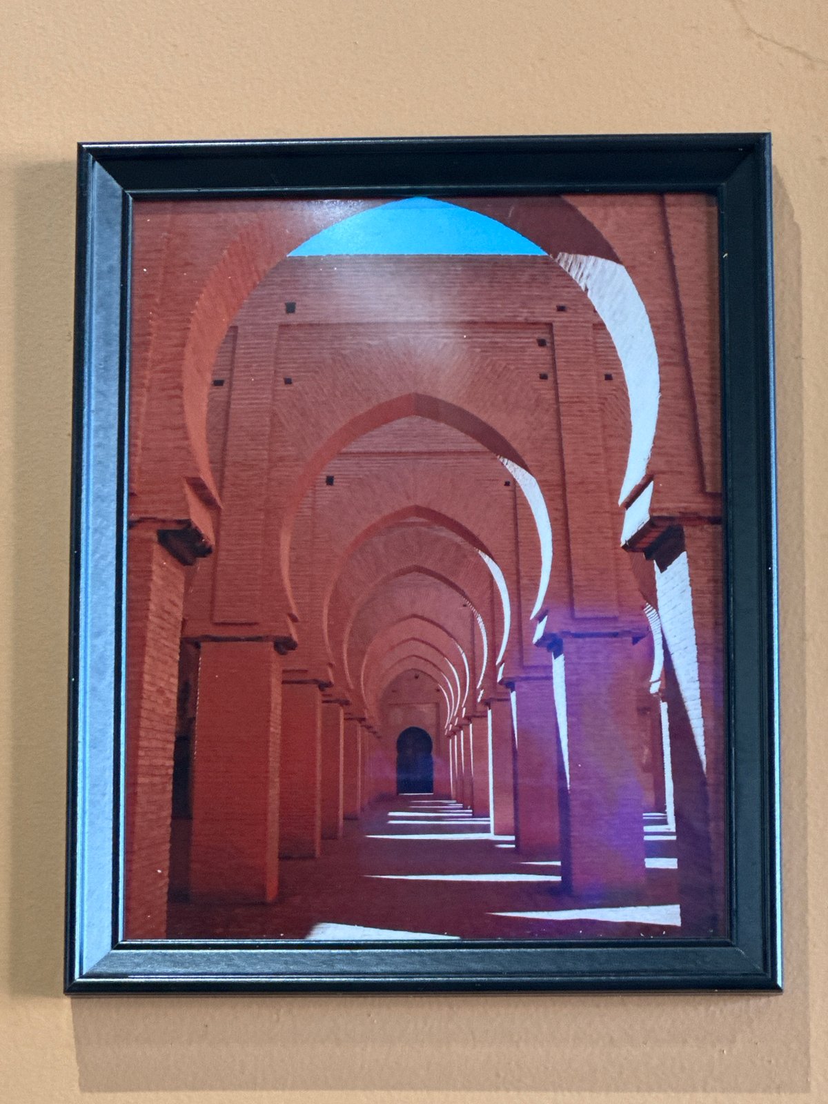 Architectural photography spanning a brick hallway and Jerusalem's Dome of the Rock