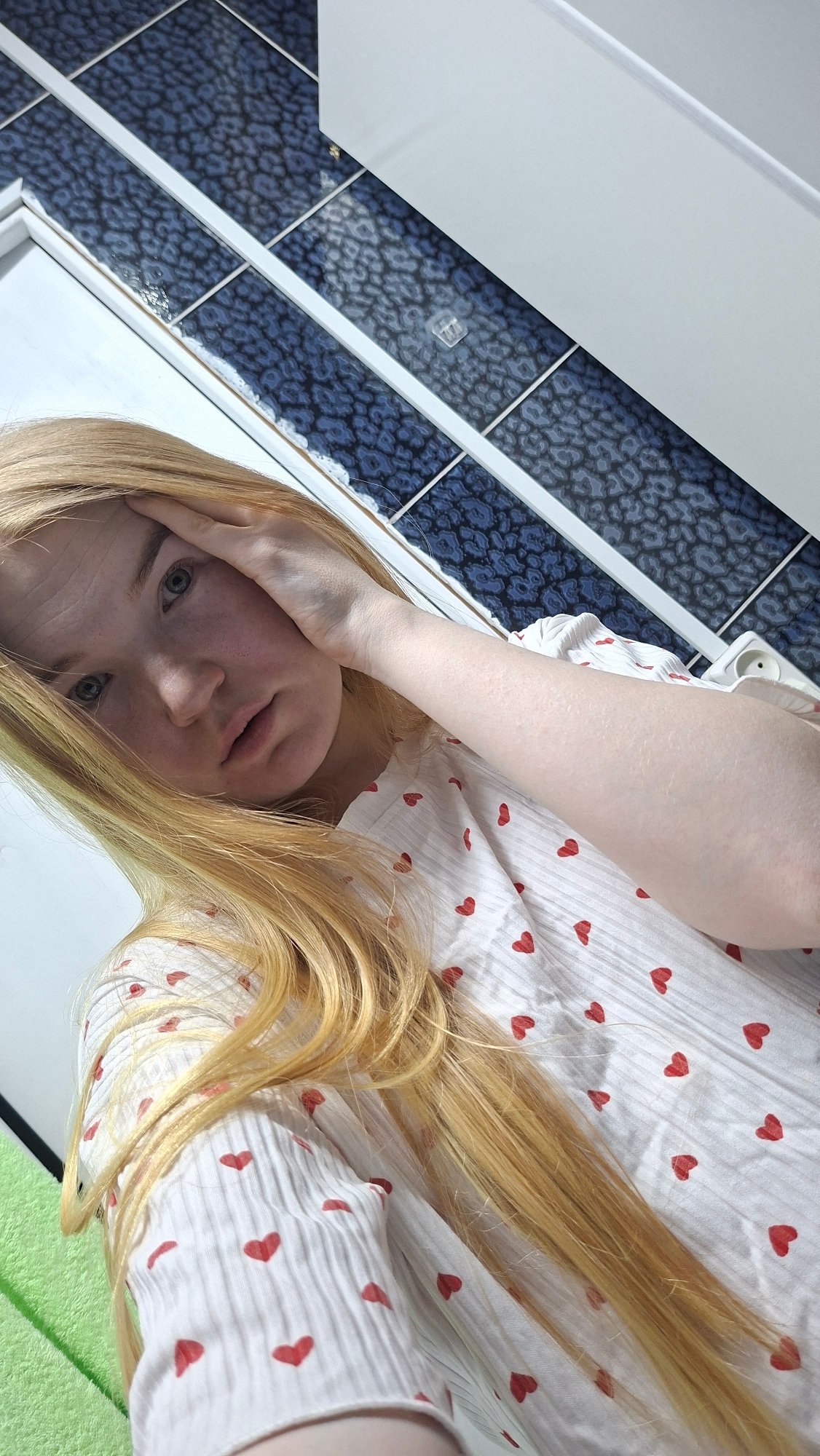 Woman Takes Multiple Selfies in Chaikovsky Bathroom