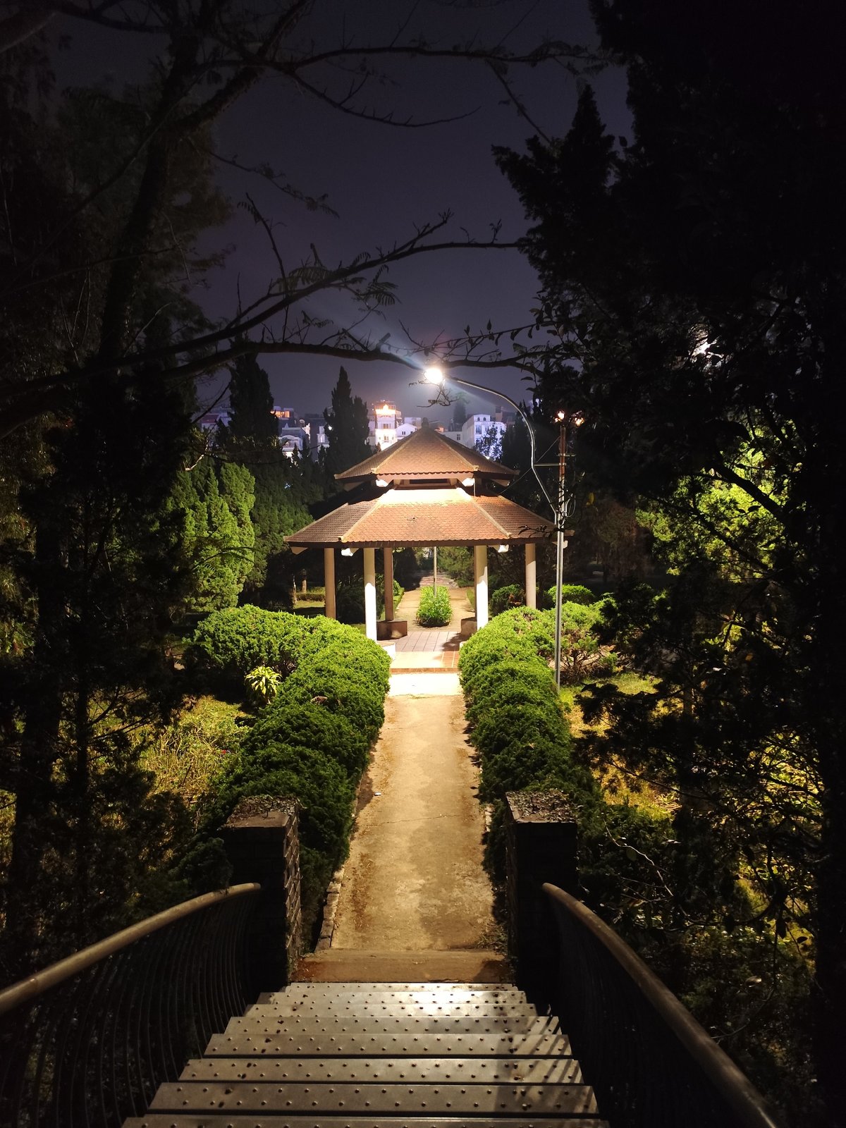 Nighttime pagoda garden pathway captured in Da Lat, Vietnam