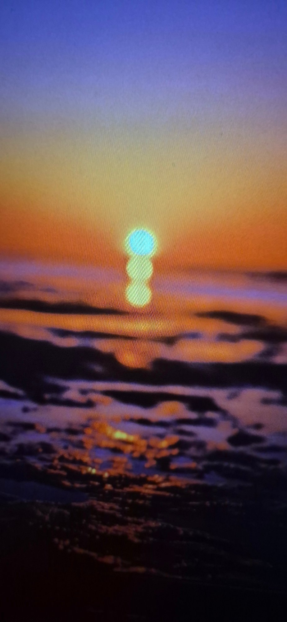 Sunset imagery and sports cars, real and digital