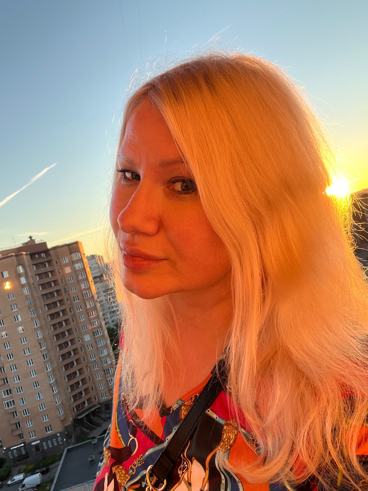 Golden hour in Sinyavino: streets, rooftops, and sunset skies