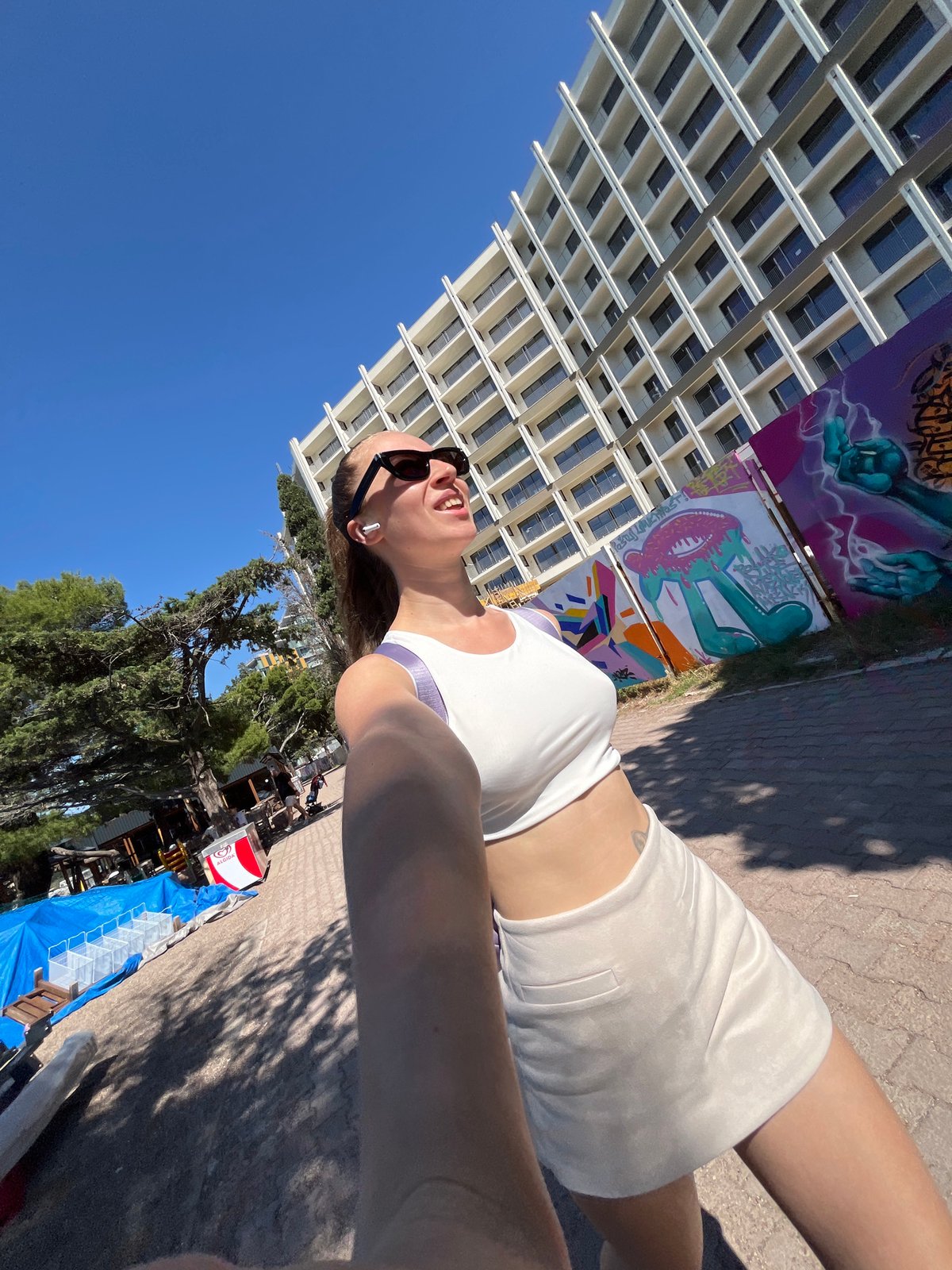 Woman takes upward-angled selfie in Rafailovići, Montenegro