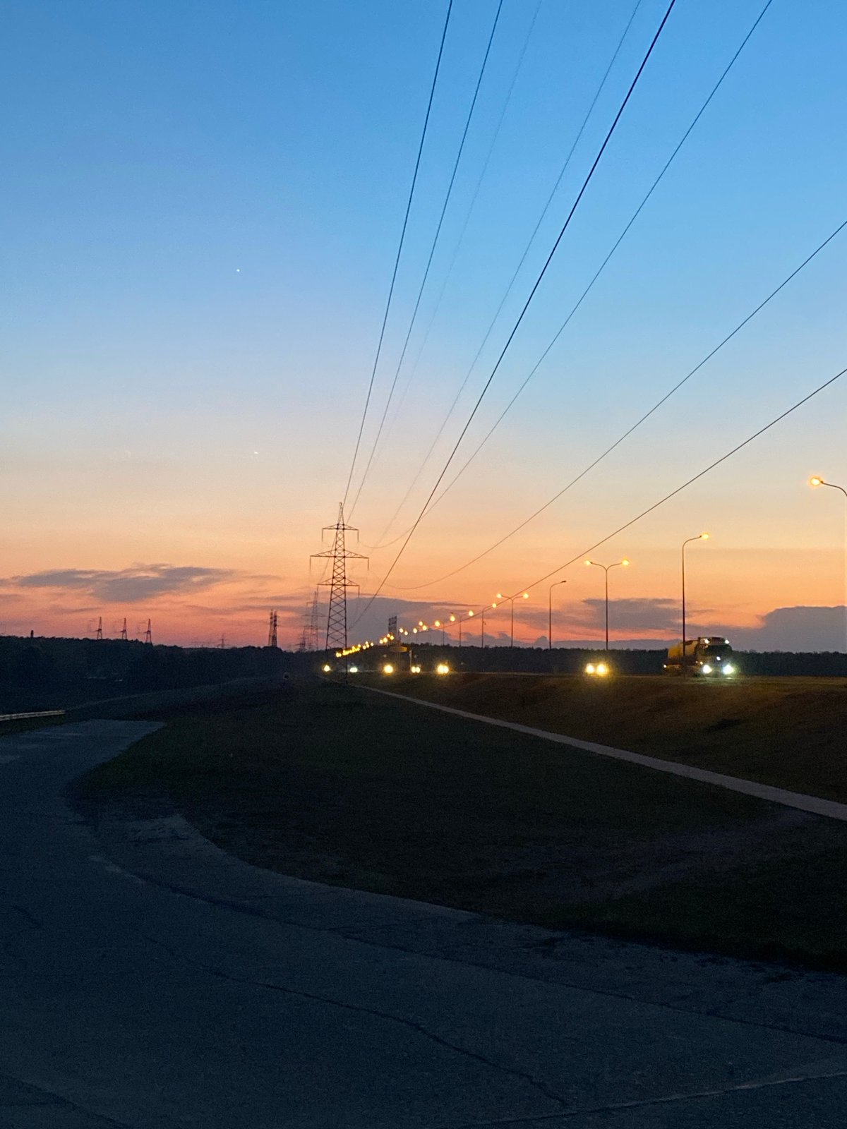 Evening power lines and pathways documented in Chaikovsky