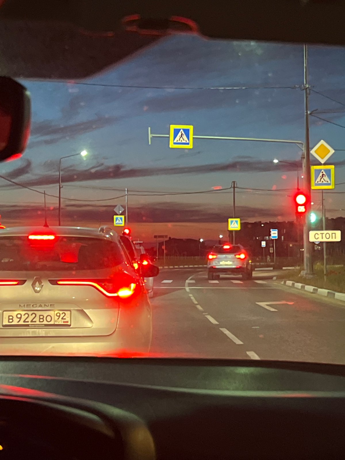Evening drive through suburbs during sunset with traffic delays