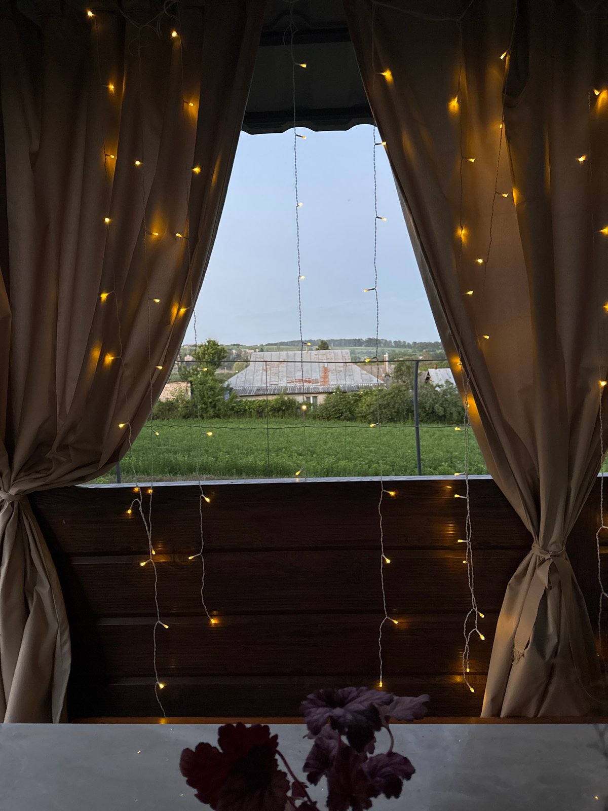 Gazebo, grain fields, and wildflowers at rural dusk