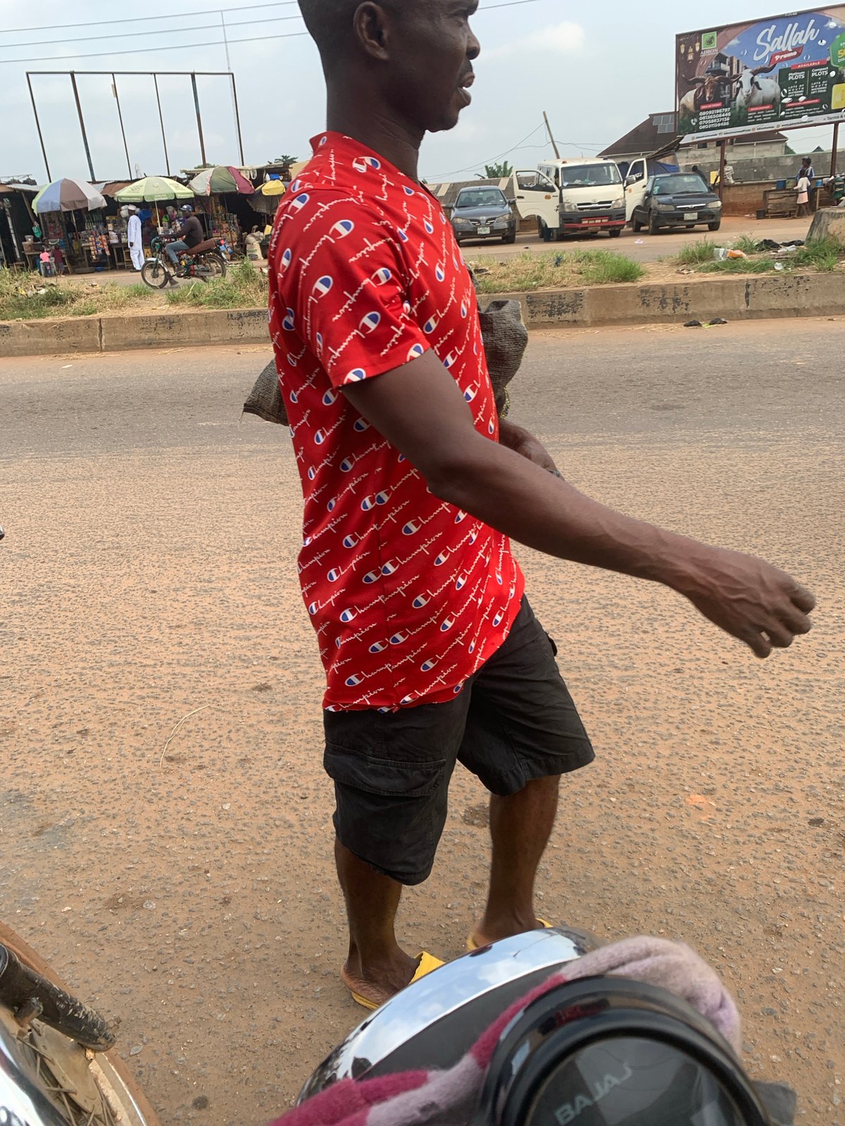 Everyday street life and motorcycle traffic in Shagamu, Nigeria