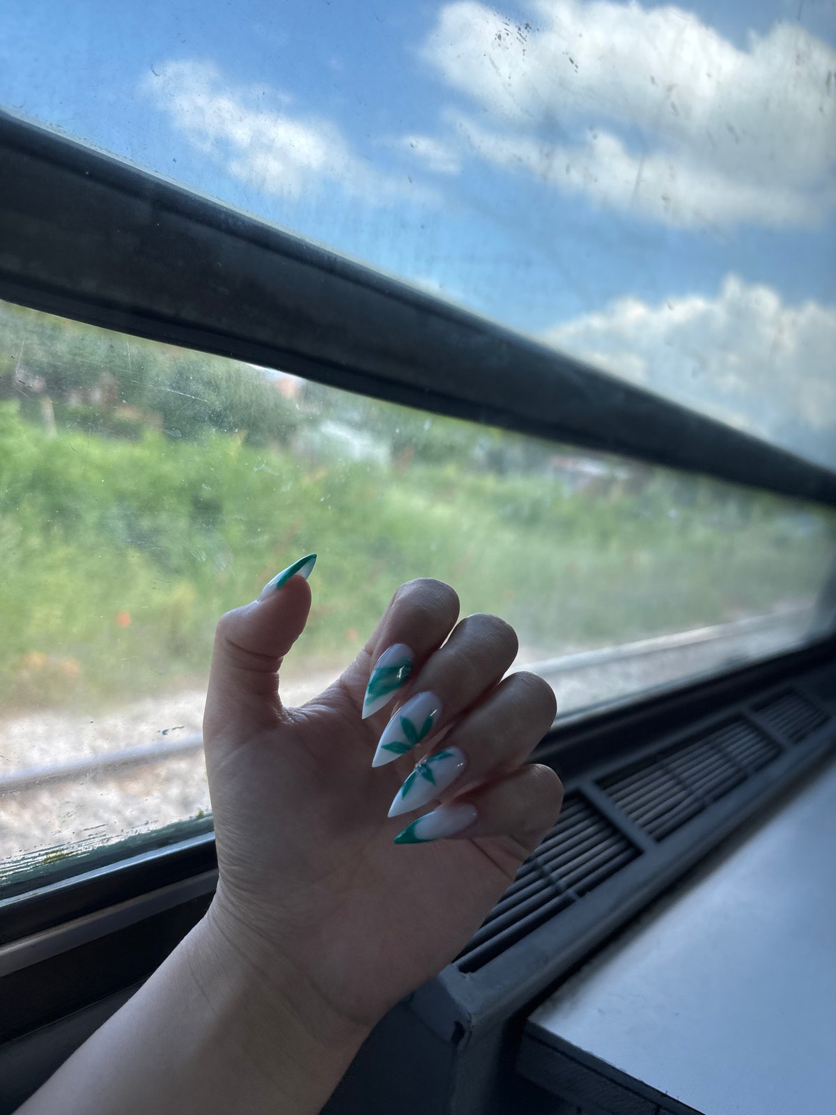 Personal moments captured: nail art display and cold beverage