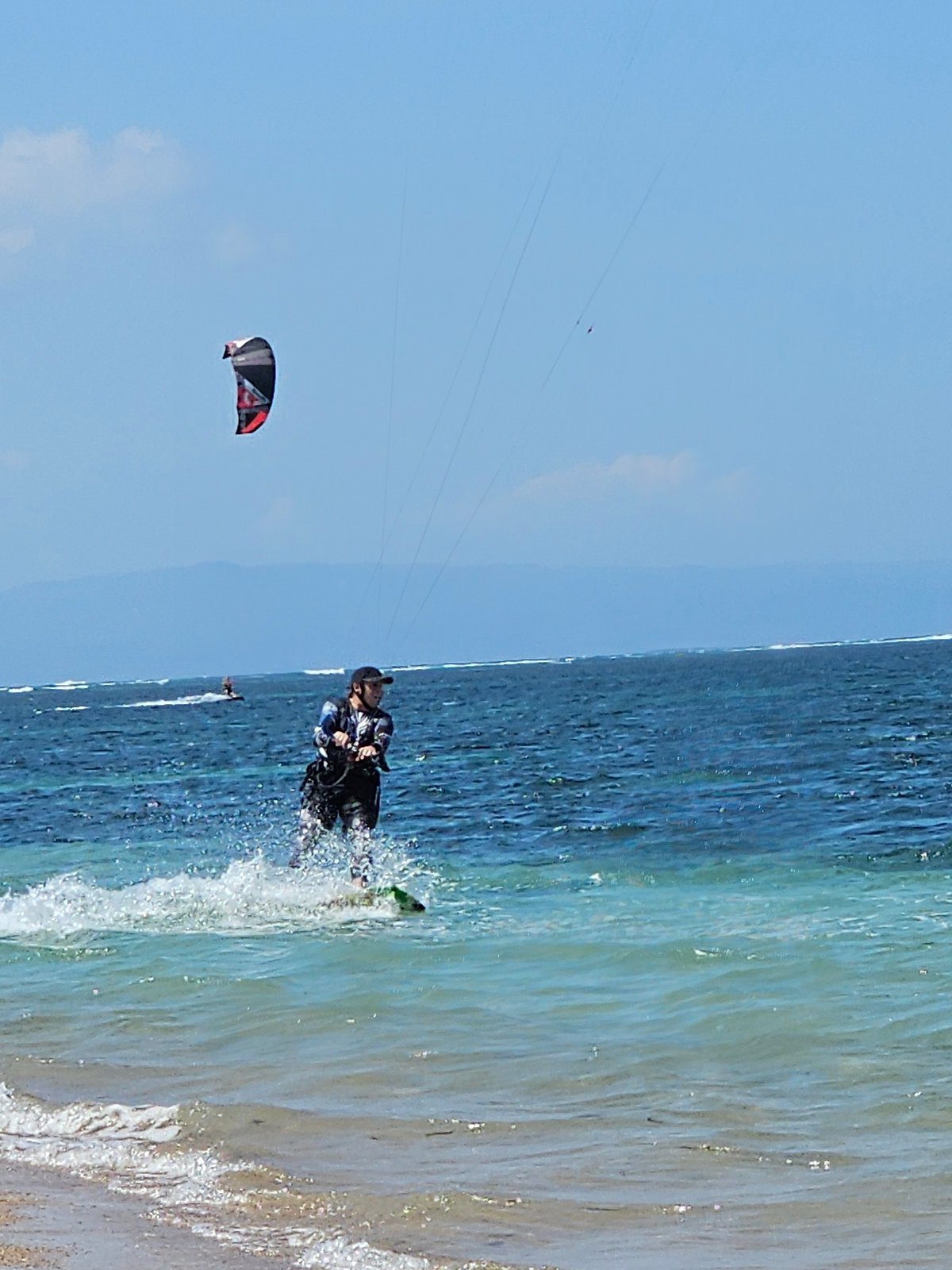 Morning kiteboarding sessions on Denpasar beach with ideal conditions