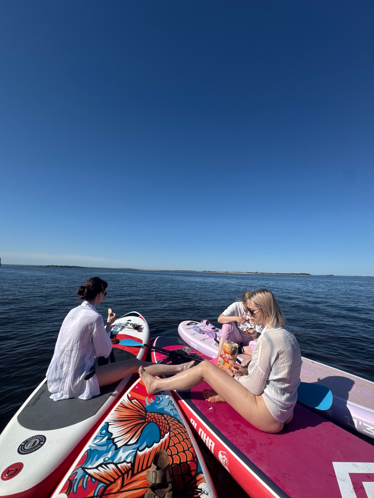Women enjoy paddleboarding session on Russian waterway