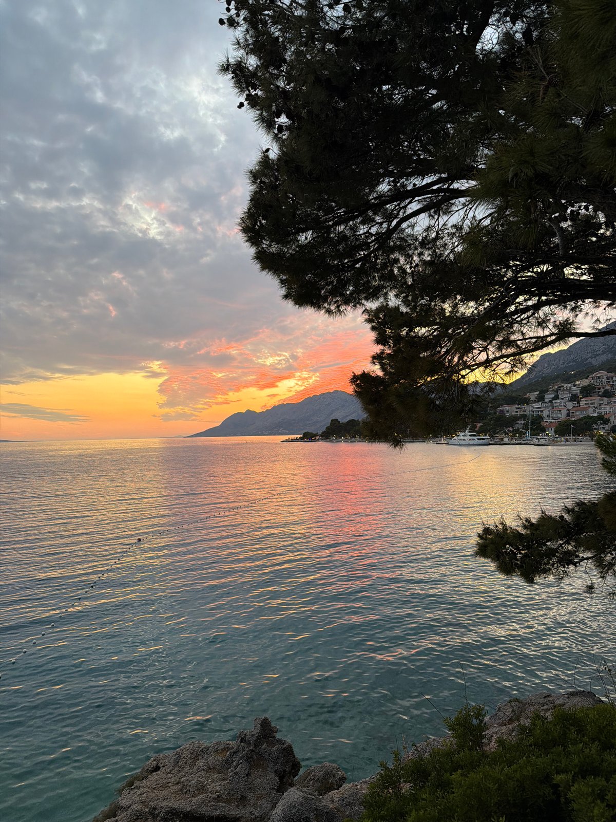 Adriatic sunset paints the sky orange and pink in Brela