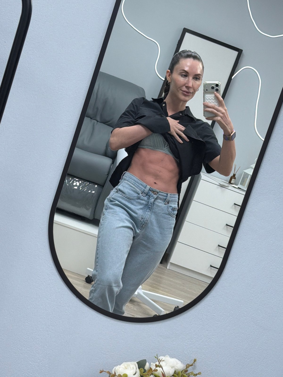 Woman takes mirror selfie in Perm, Russia