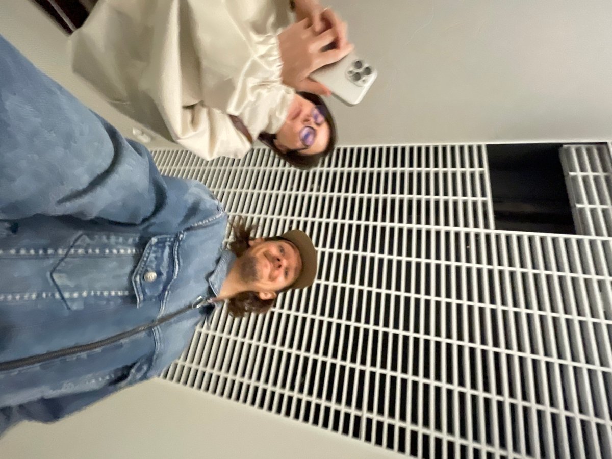Early morning selfie session in Izhevsk hallway captures two friends
