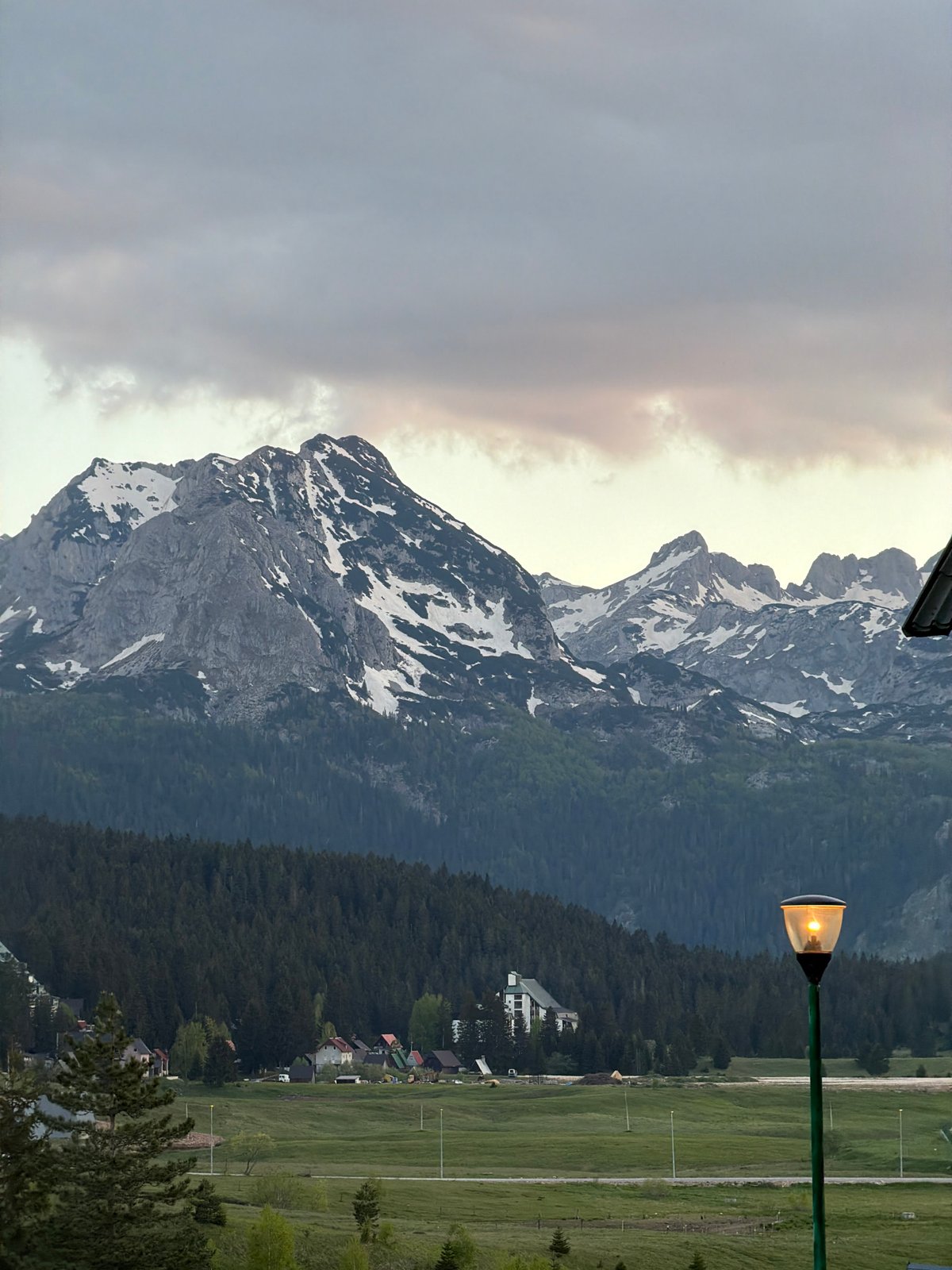 Snow-capped mountains observed in Žabljak, Montenegro evening landscape