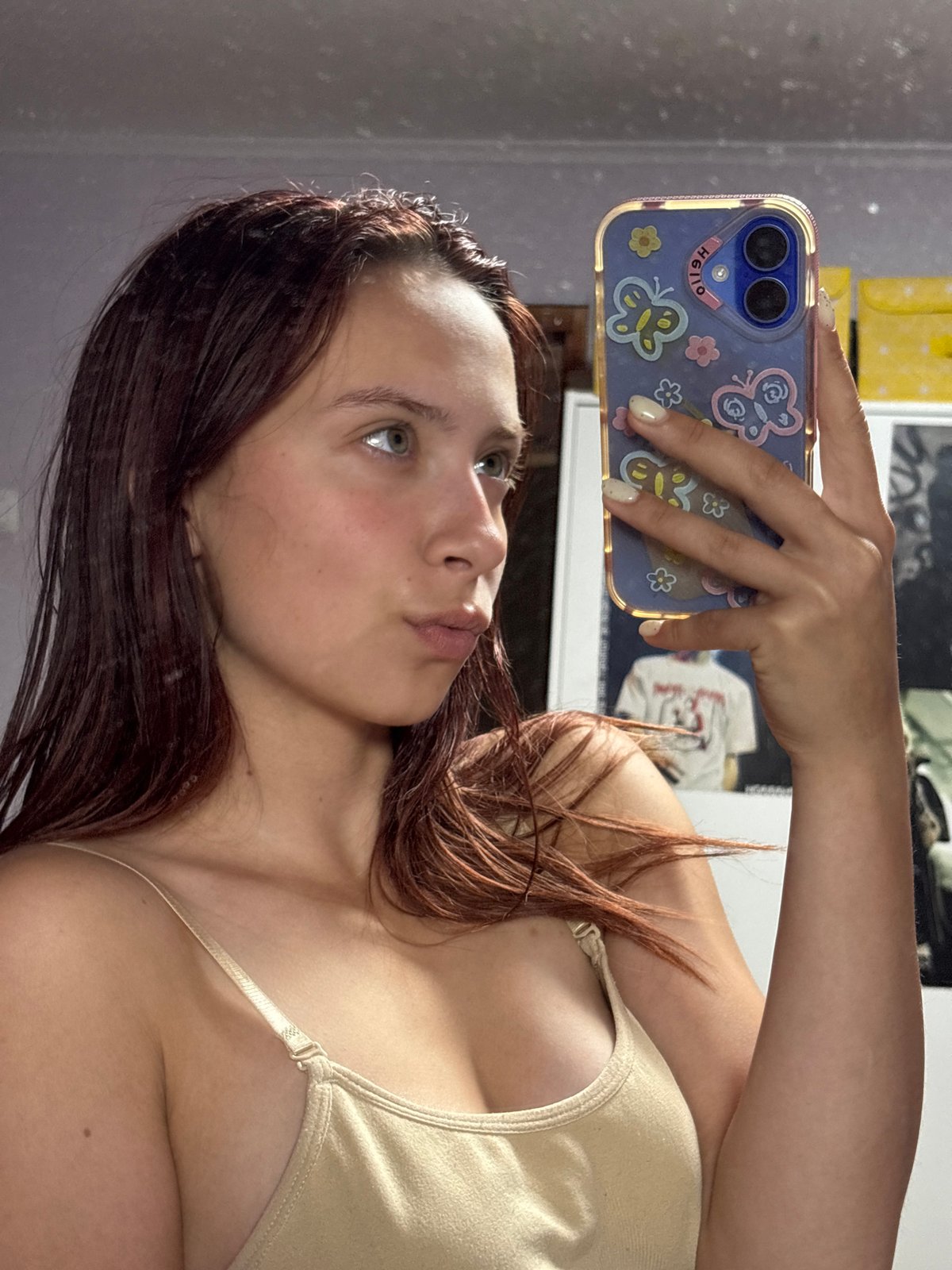 Woman takes morning selfies in Russian bedroom