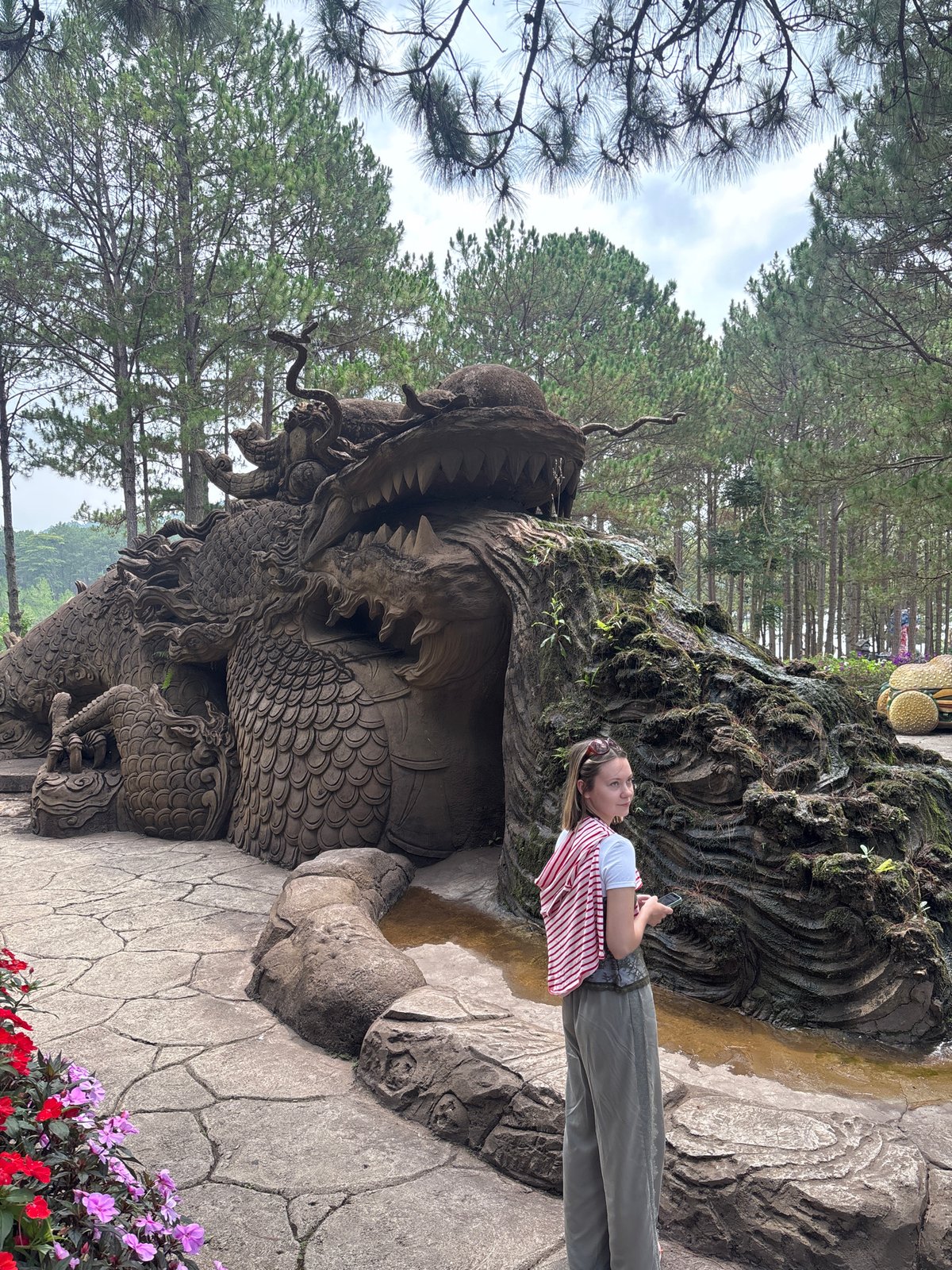 Tourists view dragon, monkey sculptures in Da Lat forest