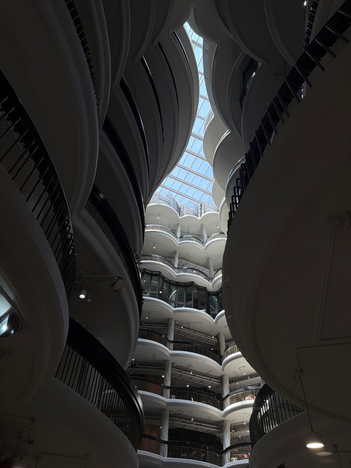 Woman takes bathroom selfies in modern Singapore building