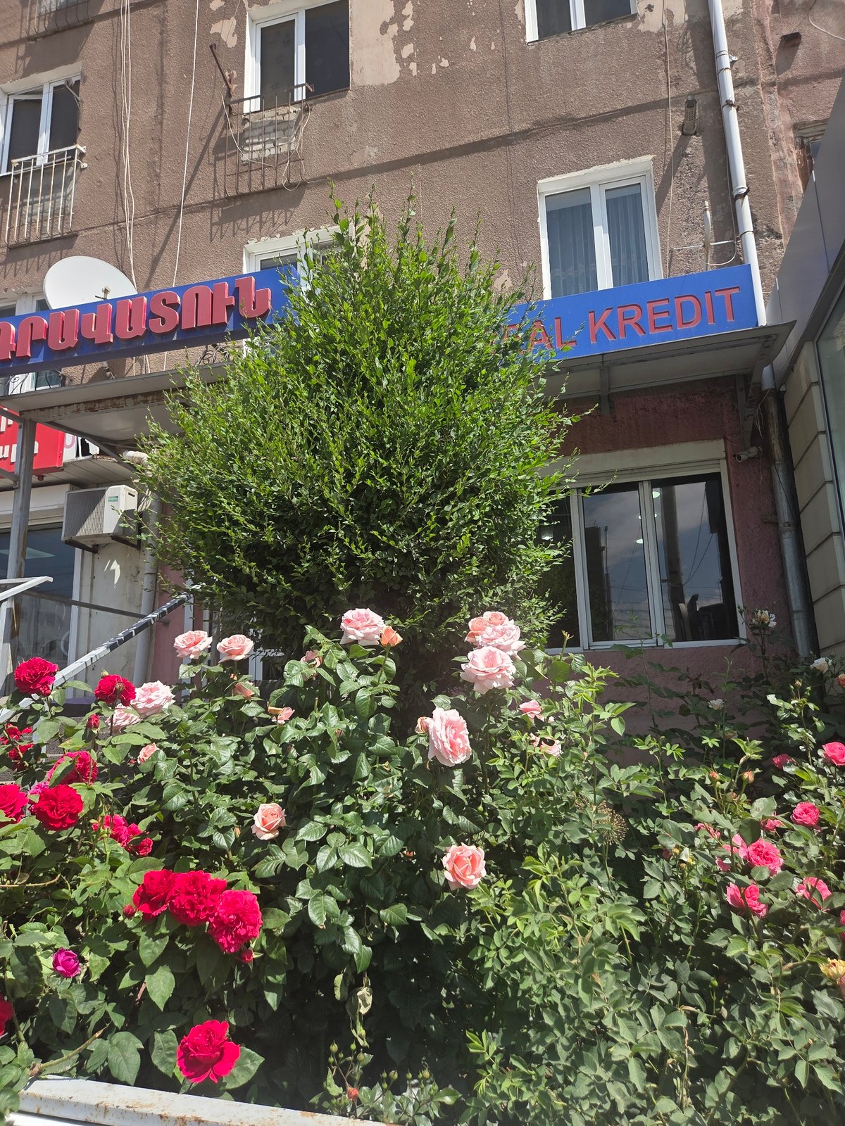 Storefronts and signage along Gyumri-Akhuryan's commercial street