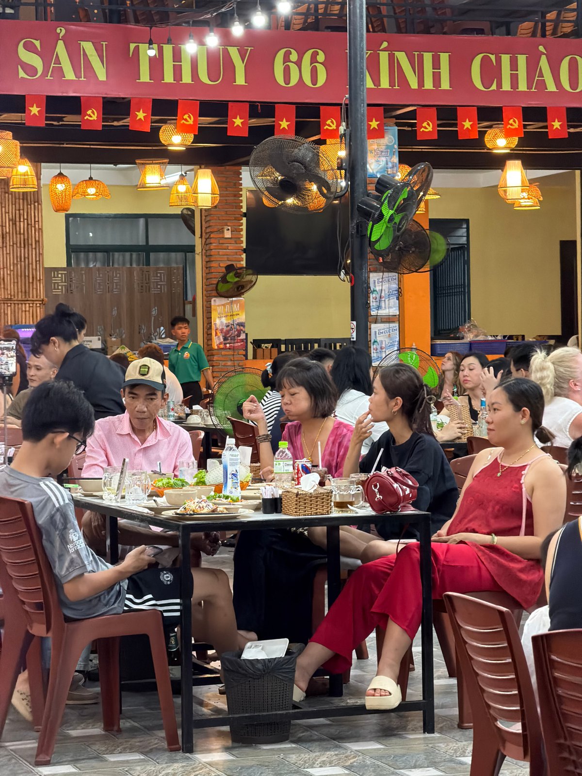 Tourist documents evening stroll through Nha Trang markets and shops