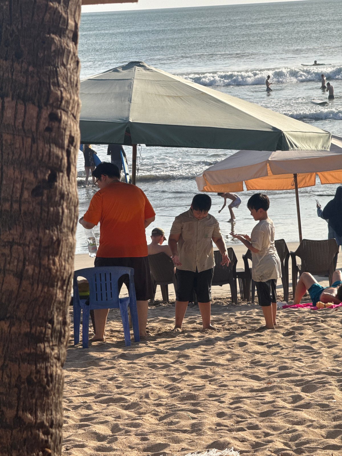 Busy morning on the sand at Kuta Beach